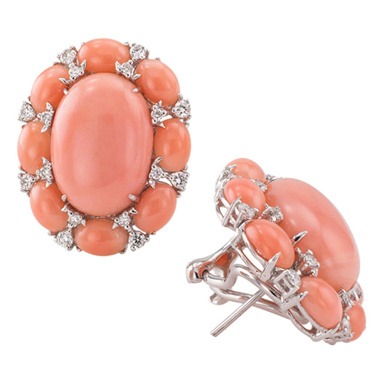 Estate Coral And Diamond Earrings

A really pretty shade of coral, so well matched throughout, with just the right amount of diamonds bringing their special kind of glitter and sparkle to what amounts to a very elegant and beautiful pair of