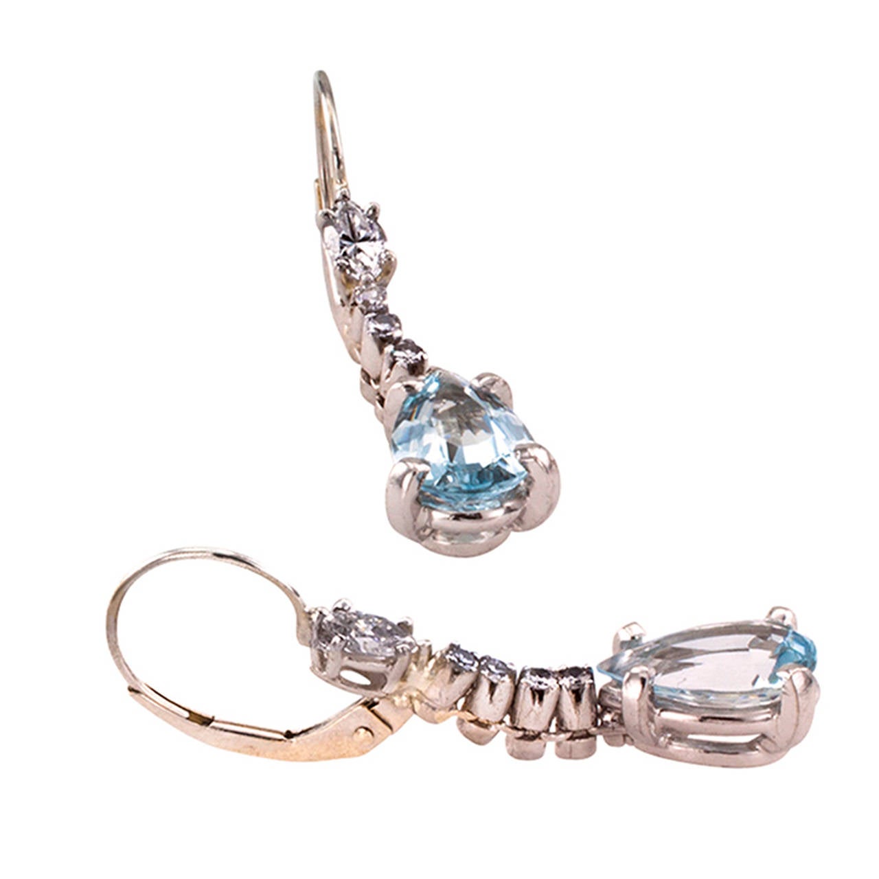 Estate Aquamarine And Diamond Pendant Earrings

Aquamarine and diamond may be the birthstones for March and April respectively, but they sure look nice together.  As in this attractive, easy, kind of everyday-wear pair of earrings.  The
