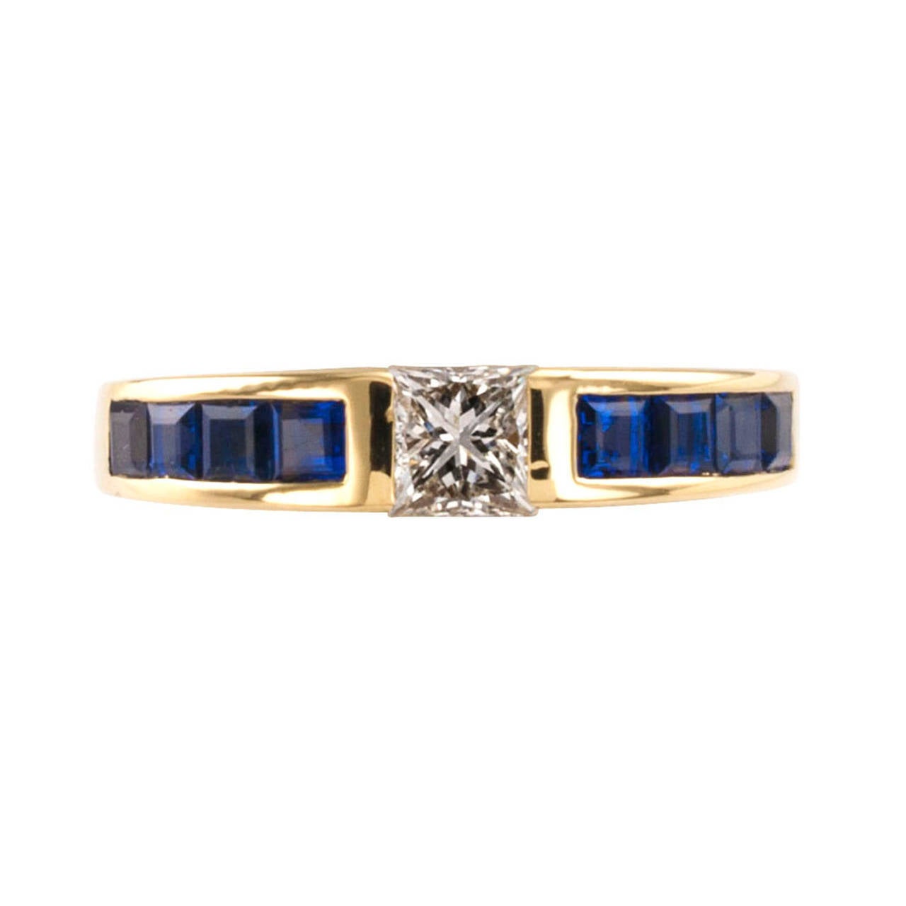 Tiffany Estate Princess-Cut Diamond and Sapphire Ring Band

Very tailored and refined, very Tiffany.  The ring features a princess-cut diamond weighing approximately 0.35 carat, approximately G - H color and VS clarity, set between eight