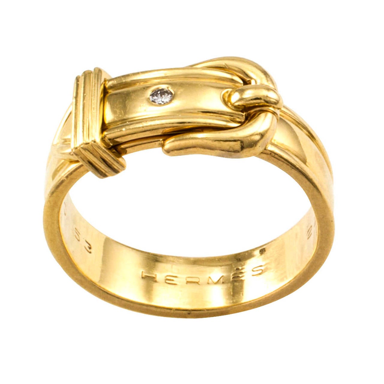 Hermes Buckle Ring Band

A traditional buckle style ring with a subtle je ne sais quoi that comes across as something that is special and luxurious.  And it is.  Dotted with a burnish-set diamond weighing approximately 0.02 carat, mounted in 18