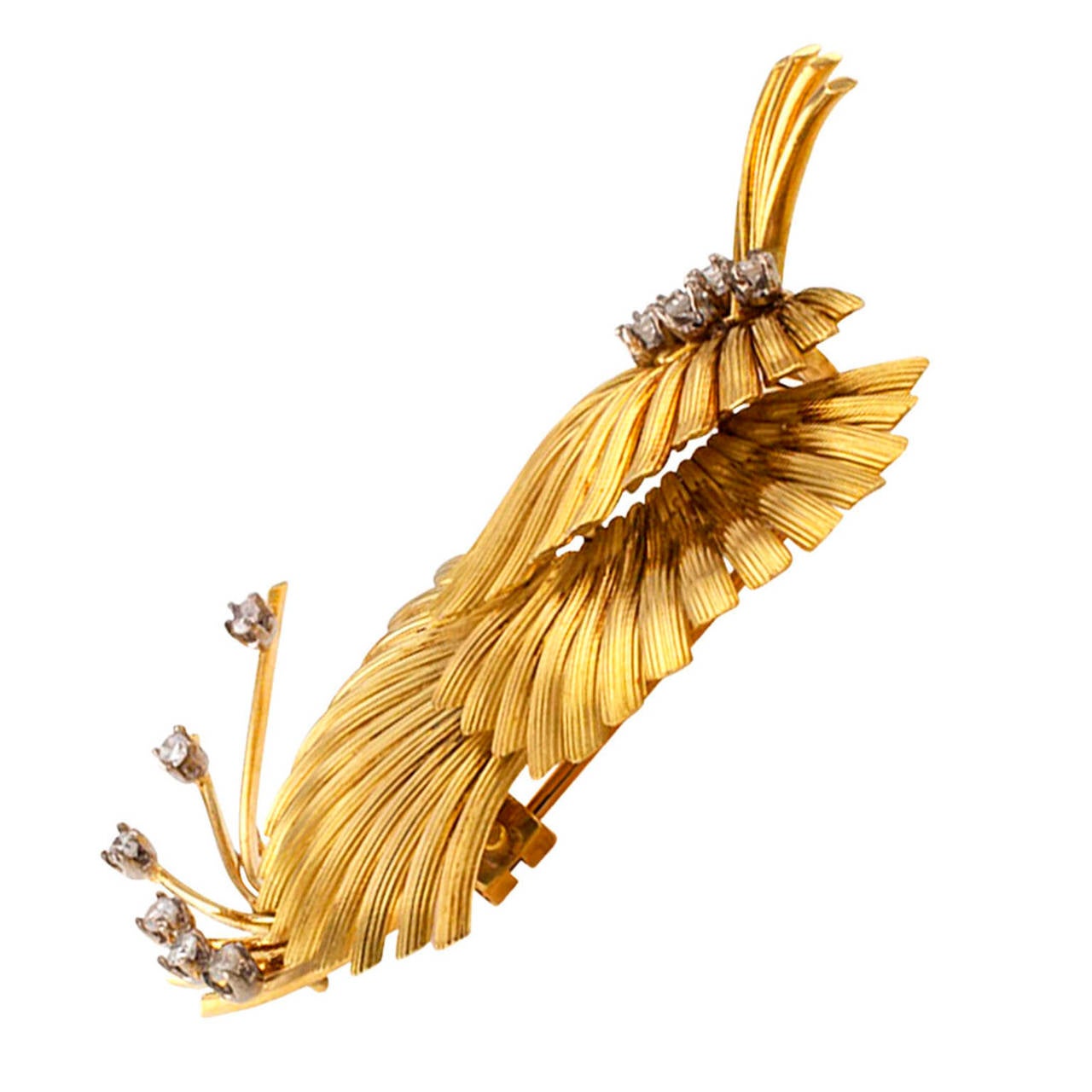Handmade Gold and Diamond Brooch in 18 karat gold

Clip brooch, full of graceful motion, exotic looking.  It is a fantasy of energized fanning motifs and wire work sprays accented with round brilliant-cut diamonds totaling approximately 0.35 carat. 
