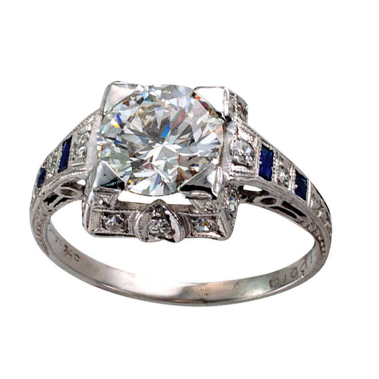 1.50 Carats G VS1 Art Deco Engagement Ring

This authentic Art Deco engagement ring set with a fine transitional cut diamond weighing 1.50 carats, graded G color and VS1 clarity by EGL U.S.A., between shoulders set with alternating smaller