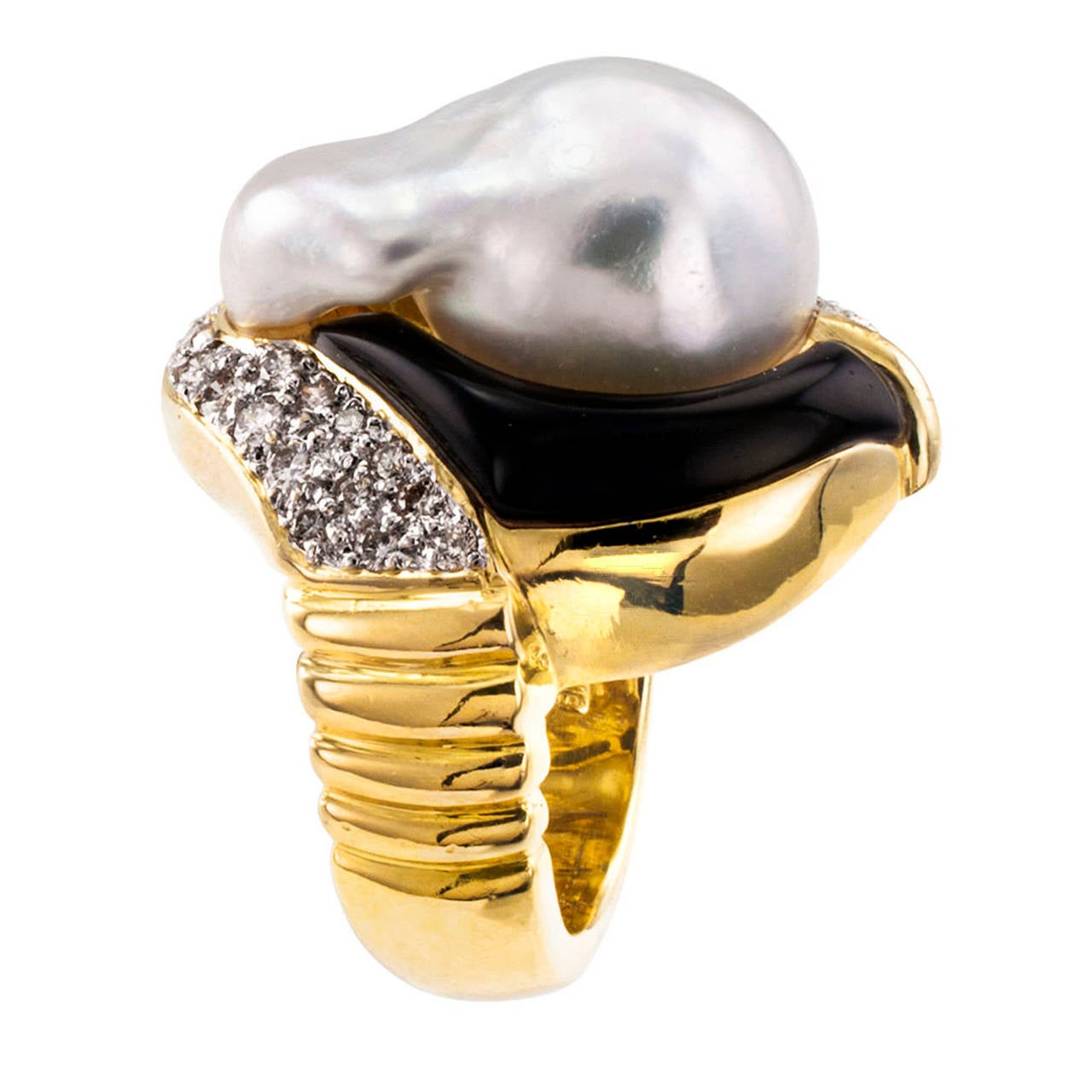 Baroque South Sea Pearl Onyx and Diamond Ring

An inventive way of bringing together precious materials to create a design that has the visual qualities of a dream. Sporting a distinctly different look form every angle you look at it.  Thus making a