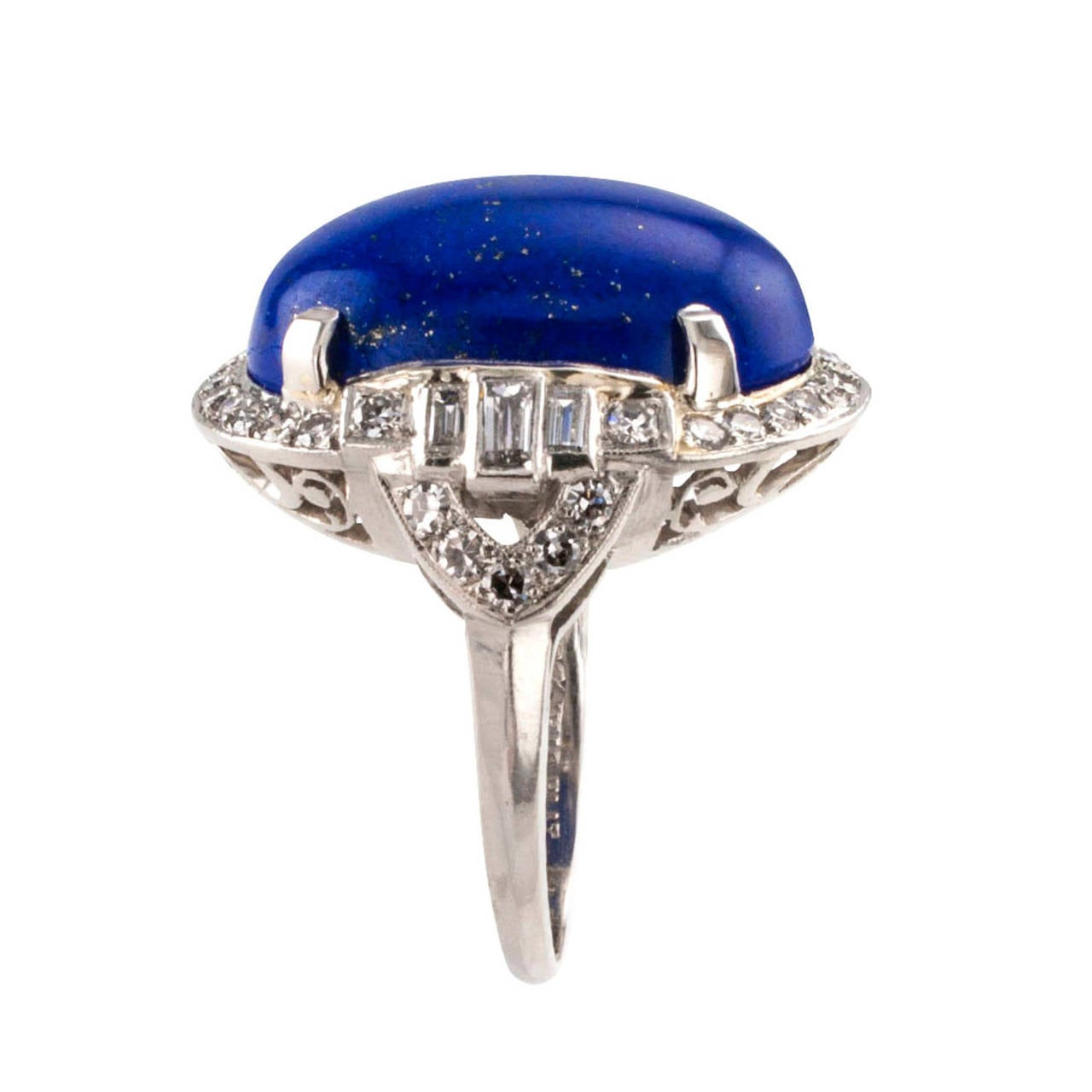 Lapis Lazuli and Diamond Dress Ring Circa 1950

A very smart looking ring set with a beautiful lapis lazuli oval cabochon, within a conforming diamond border characterized by geometric motifs, the forty-four baguette and circular-cut diamonds