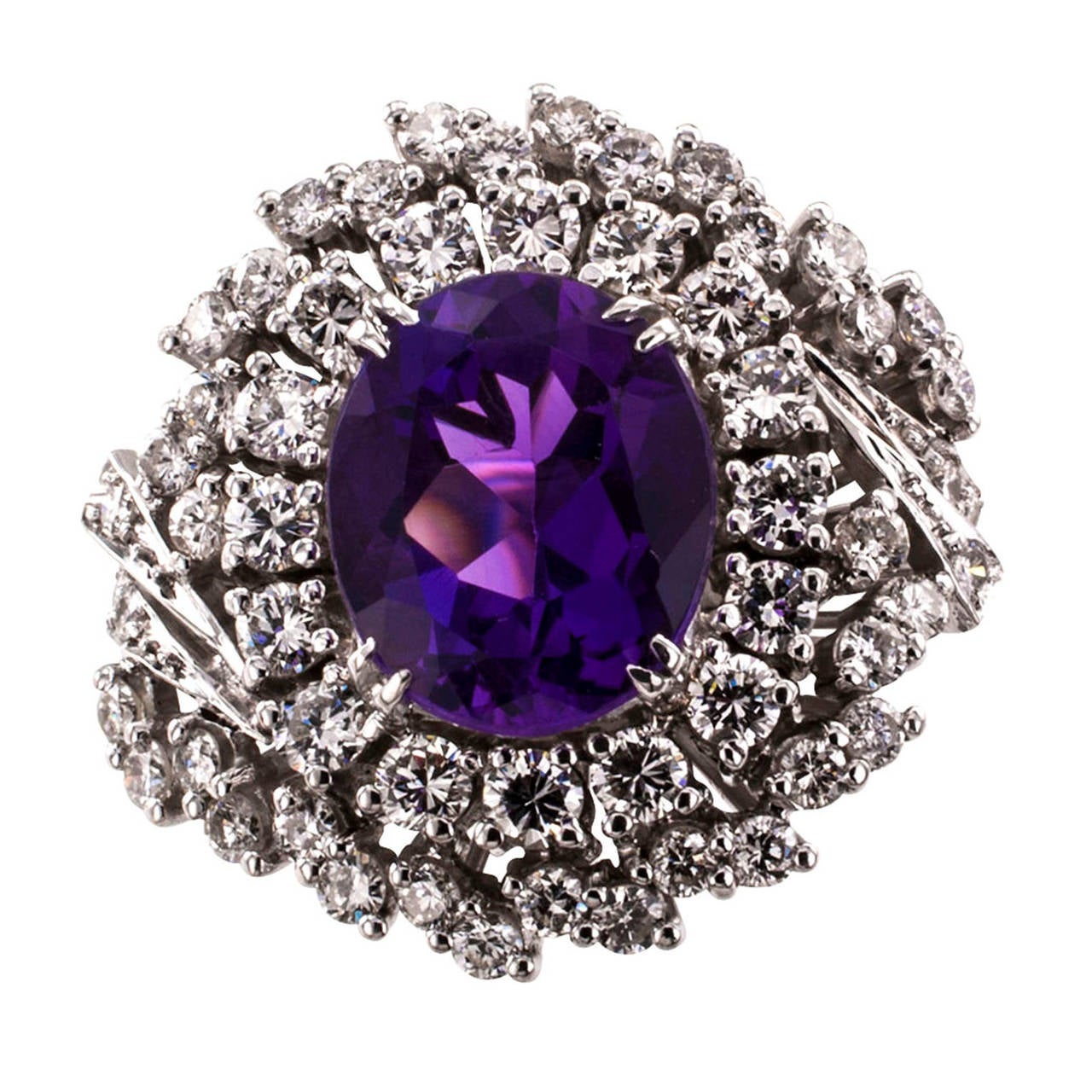 Amethyst and Diamond Cocktail Ring Circa 1960

If you are going to have just one amethyst ring, let it be one as nice and beautiful as this one is.  Wearing this ring will make you feel like a queen!  Really.  The color of the amethyst is rich