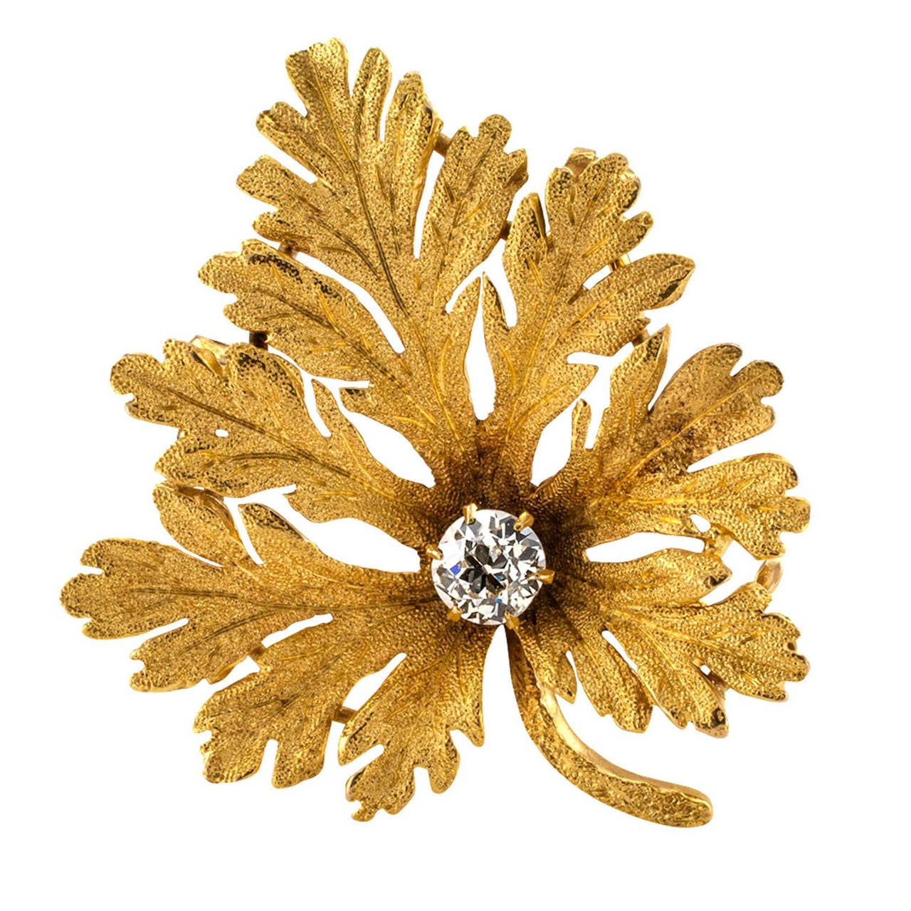 Geranium Leaf Gold and Diamond Brooch/Pendant

Not very far off from the real thing, this lovely representation of a scented geranium leaf has a folding bail on the back to allow wearing it as a pendant or as a brooch.  Made in 14k gold with a