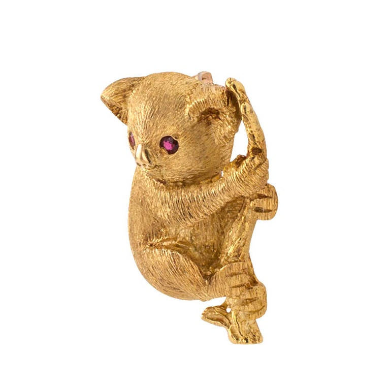 Who wouldn't want to adopt this cuddly Koala bear with adorable ruby-set eyes. Its fur details carefully outlined by hand Florentine work, in 18 karat gold, dimensions: 1
