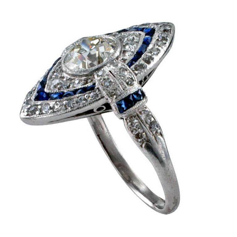 Finding true vintage Art Deco rings as beautiful as this one is rapidly becoming a rarity in itself, the navette-shaped design centers upon an old European-cut diamond weighing approximately 0.90 carat, approximately L - M color and VS clarity,
