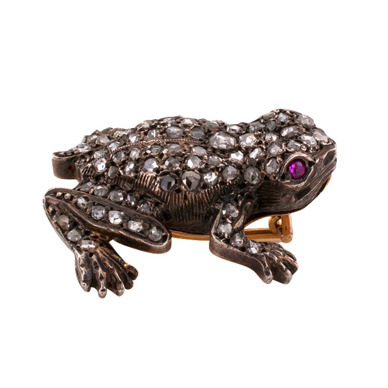 This great Victorian antique frog is ready to hop up to you.  With its body set  with rose-cut diamonds and ruby-set eyes, silver on 14kt  gold, approximately 1.00