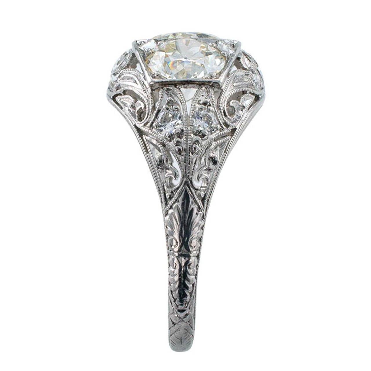 3.00 Carats TW Edwardian Three Stone Diamond Ring

Antique diamond rings that pack as much beauty and exquisite detail as this one does are becoming more rare with each passing day.  The central old European-cut diamond weighing approximately 1.20