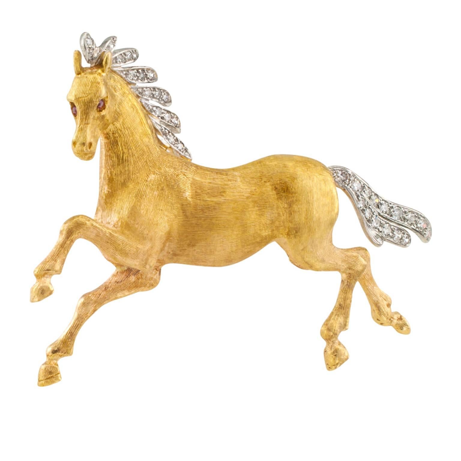 Wild Mustang Horse Brooch

A spirited wild mustang 18 karat yellow gold brooch masterfully hand-Florentined, with ruby-set eyes, platinum  flowing mane and tail set with thirty-one diamonds totaling approximately 0.40 carat, approximately G color