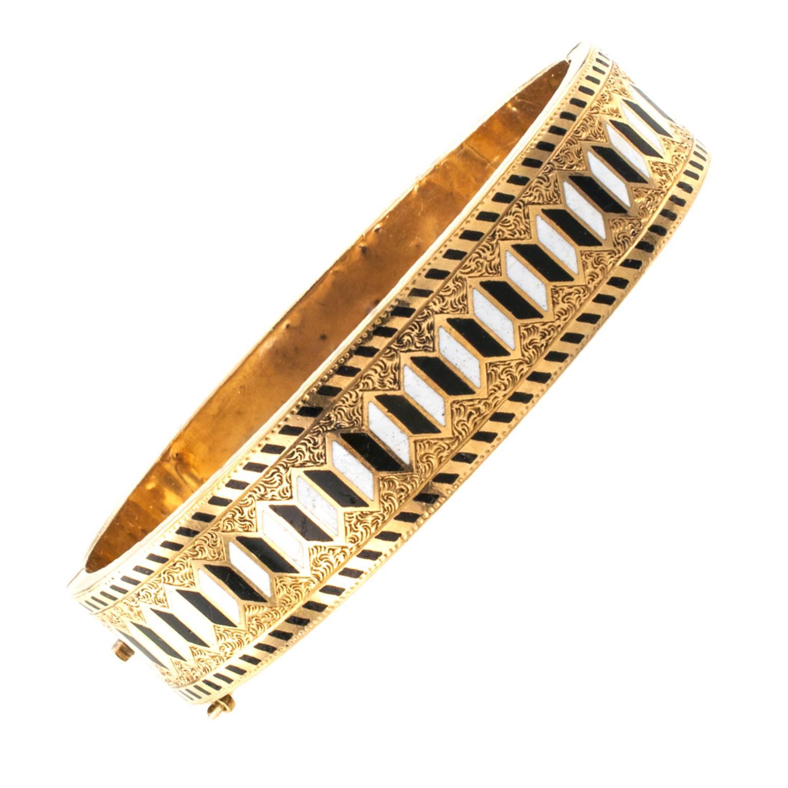 Victorian Perception Puzzle Enamel Bangle

Perception puzzle?  Geometry at play as two sets of enameled  parallel lines create an optical illusion of  motion and countermotion in the center and edges of this incredible Victorian bangle, which has