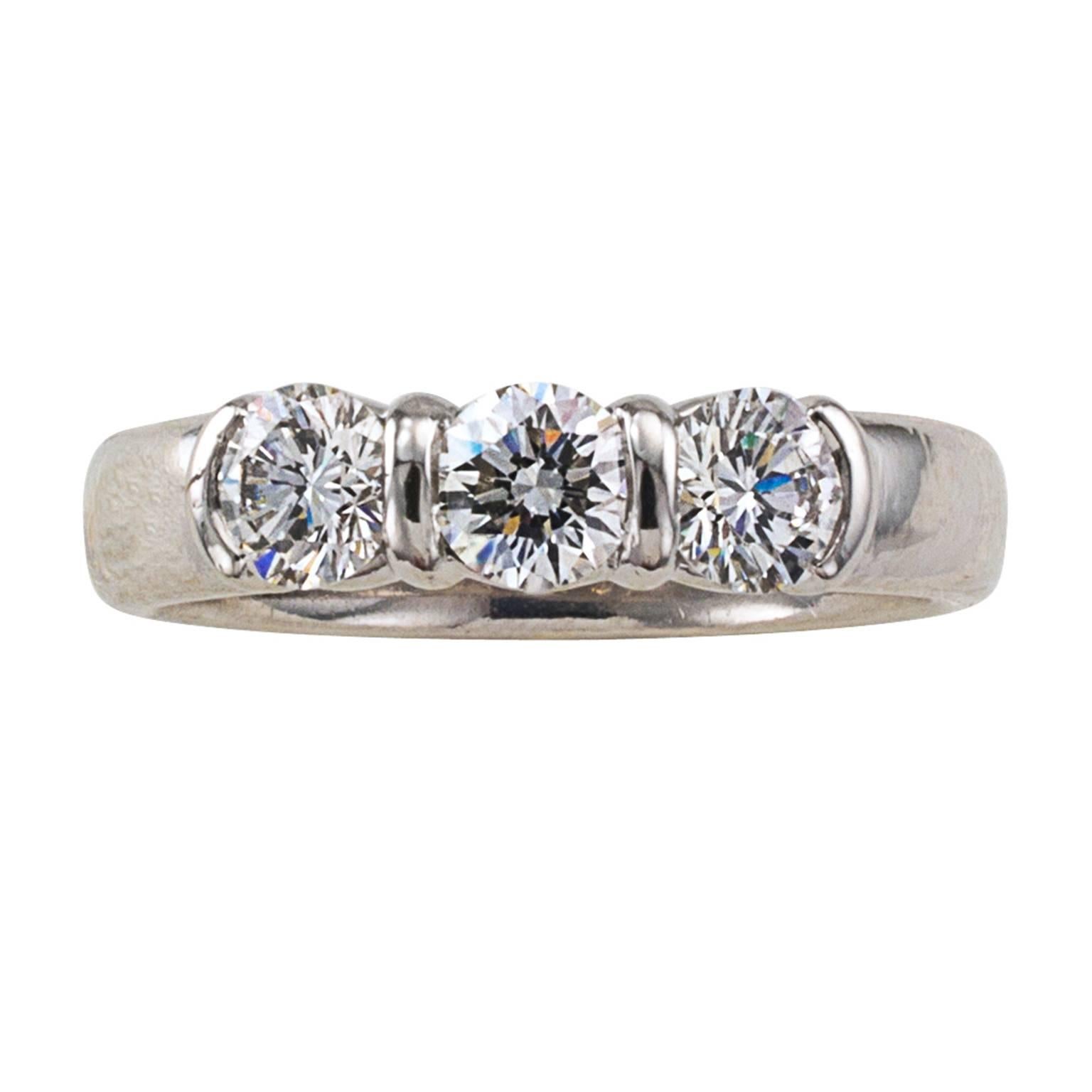 Tiffany and Company Estate Three Stone Diamond Ring

Tiffany and Company's contemporary three stone ring has all the characteristics classic styling and timeless beauty, the three round brilliant-cut diamonds together totaling approximately 0.85