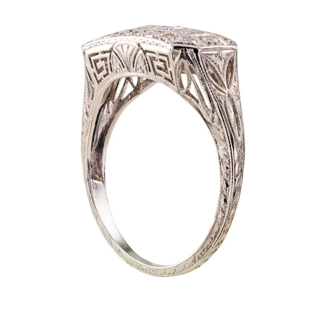 Art Deco Three-Stone Diamond Ring

Witness the epitome of Art Deco platinum pierced work.  Delicate, intricate patterns geometrically arranged to glorify the three diamonds that dominate the upper surface of the design, set throughout with