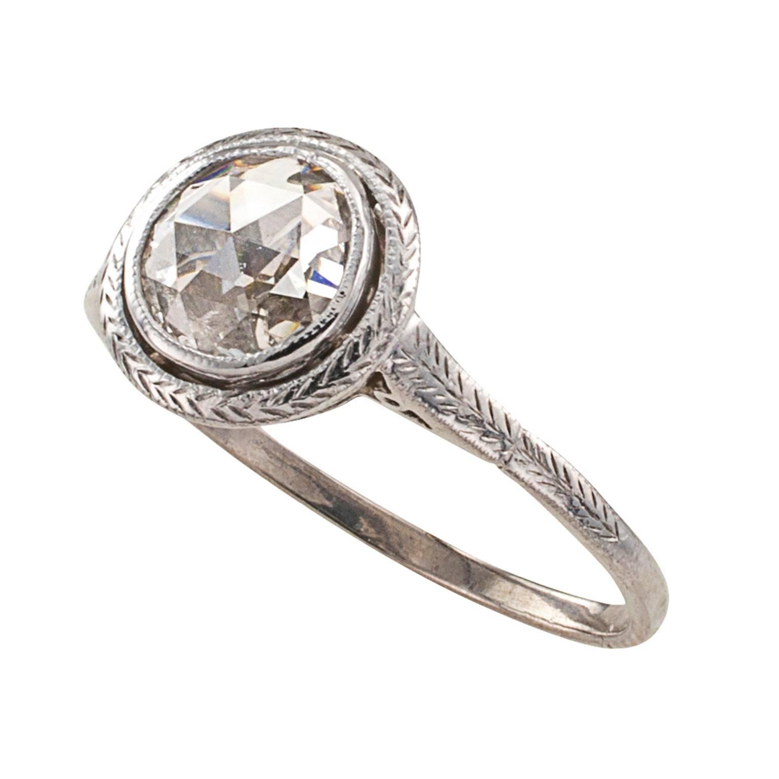 .60 Carat Rose-cut Diamond Solitaire Engagement Ring

The essence of simplicity and the thrill of an antique rose-cut diamond solitaire ring, not bad! The sort of thing that doesn't happen very often in genuine Edwardian engagement rings.  The