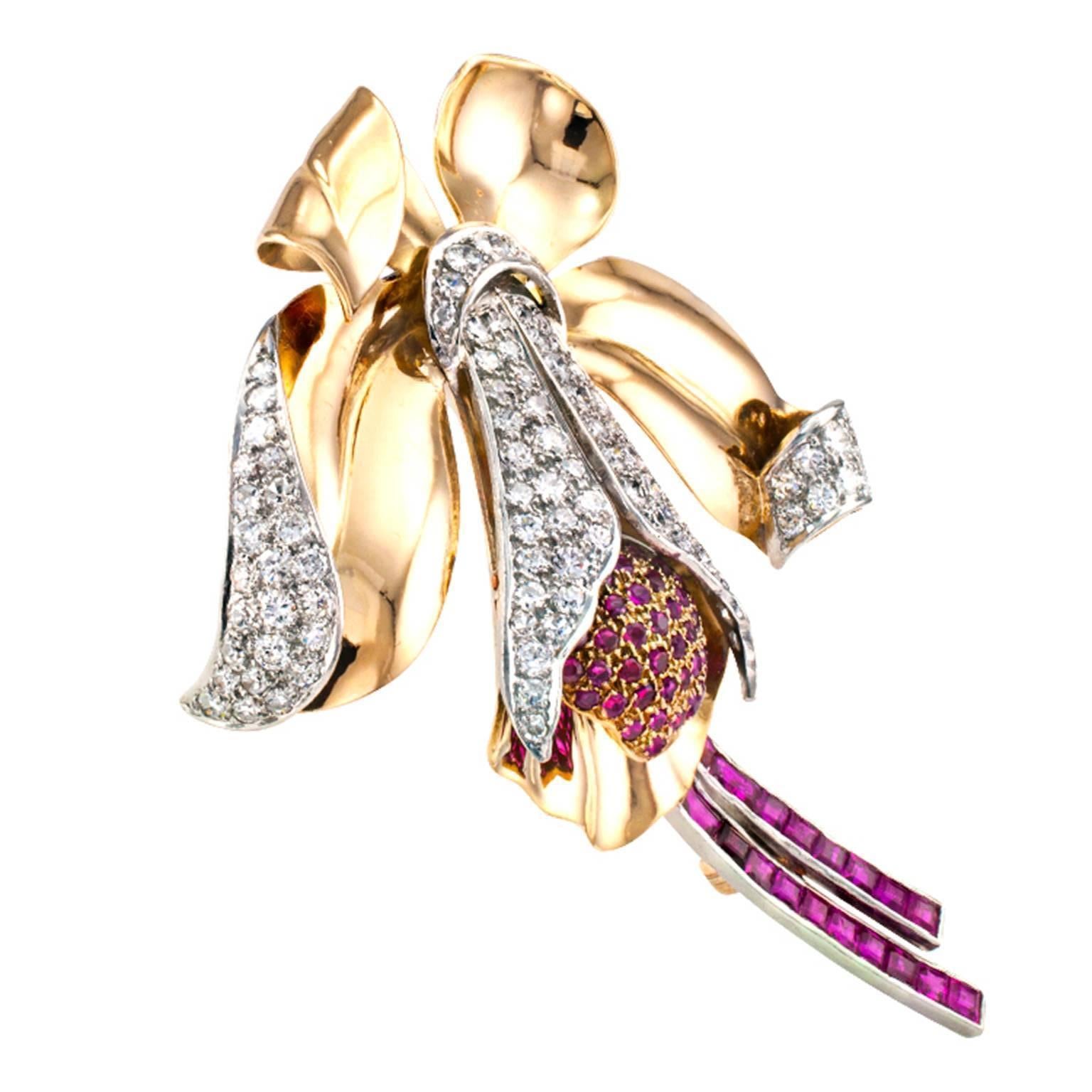 Retro Orchid Ruby and Diamond Brooch

Undeniable retro styling and scale unfolding into the shape of one of the most exotic and unusual flowers in the world, known for their ability to draw attention, while all at once evoking elegance, innocence