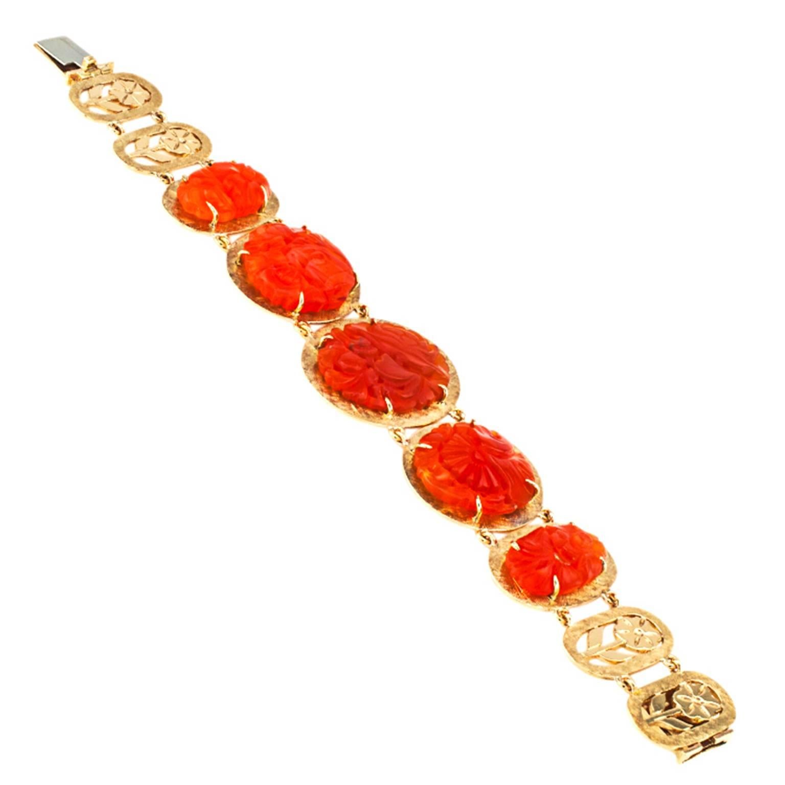 Unique Carved Carnelian and Gold Bracelet

A crafty magician must have gone around and captured flashes of orange color from a glorious sunset, from fall foliage, from rose petals in a magic garden,  and from the brilliance of the rising sun.  He