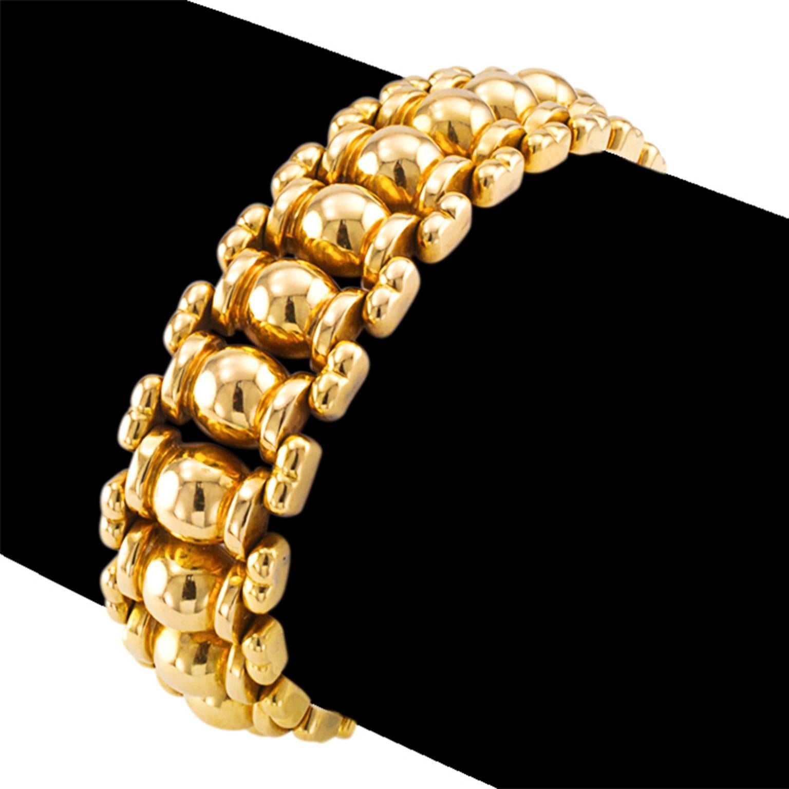 Retro 18Kt Gold Bracelet

Attractive and very wearable, an array of convex geometric shapes arranged with just the right amount of space in between them to allow light to play hide and seek, shining back at  the world in that fascinating way that