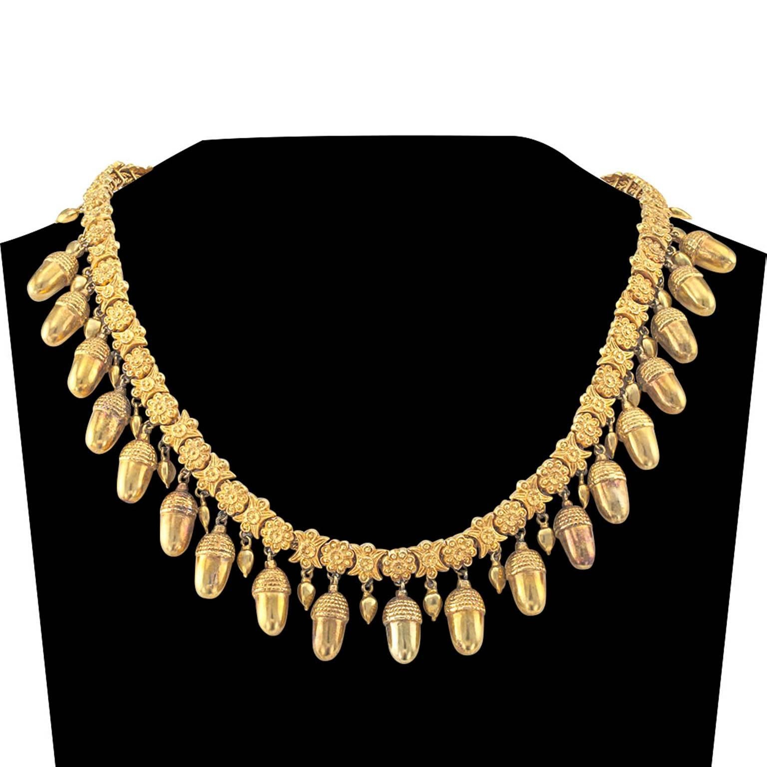 Antique Gold Acorn Necklace

Victorians were very fond of acorns, associating them with longevity and wealth and prosperity. In that respect, this necklace could not be more loaded with symbolism.  The acorn garland encircles the totality of the