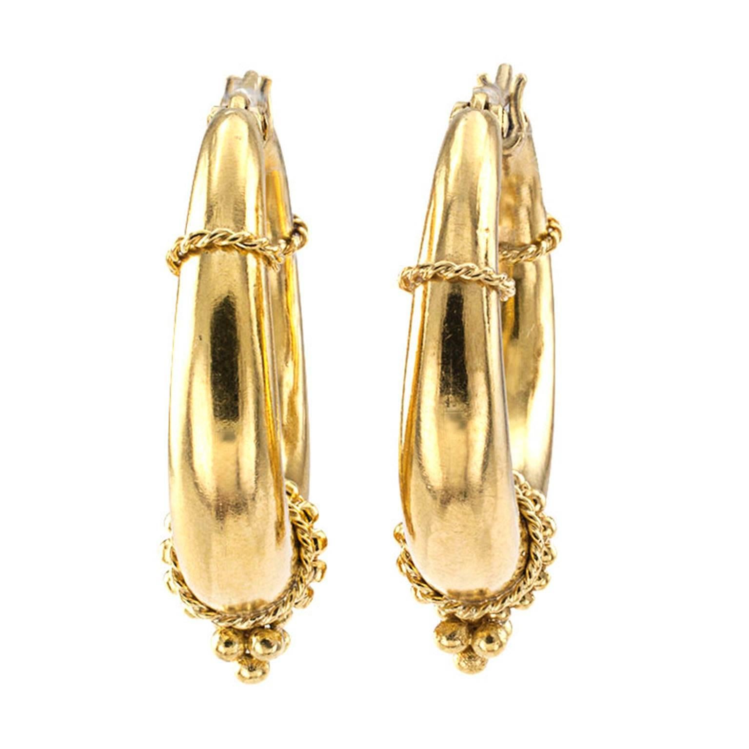 Temple St Clair 18 Karat Gold Hoop Earrings

Modern and  attractive gold hoops with an ancient flair telling in part the story of Temple St. Clair's design inspiration, which according to her bio is driven by an artist's heart and an explorer's