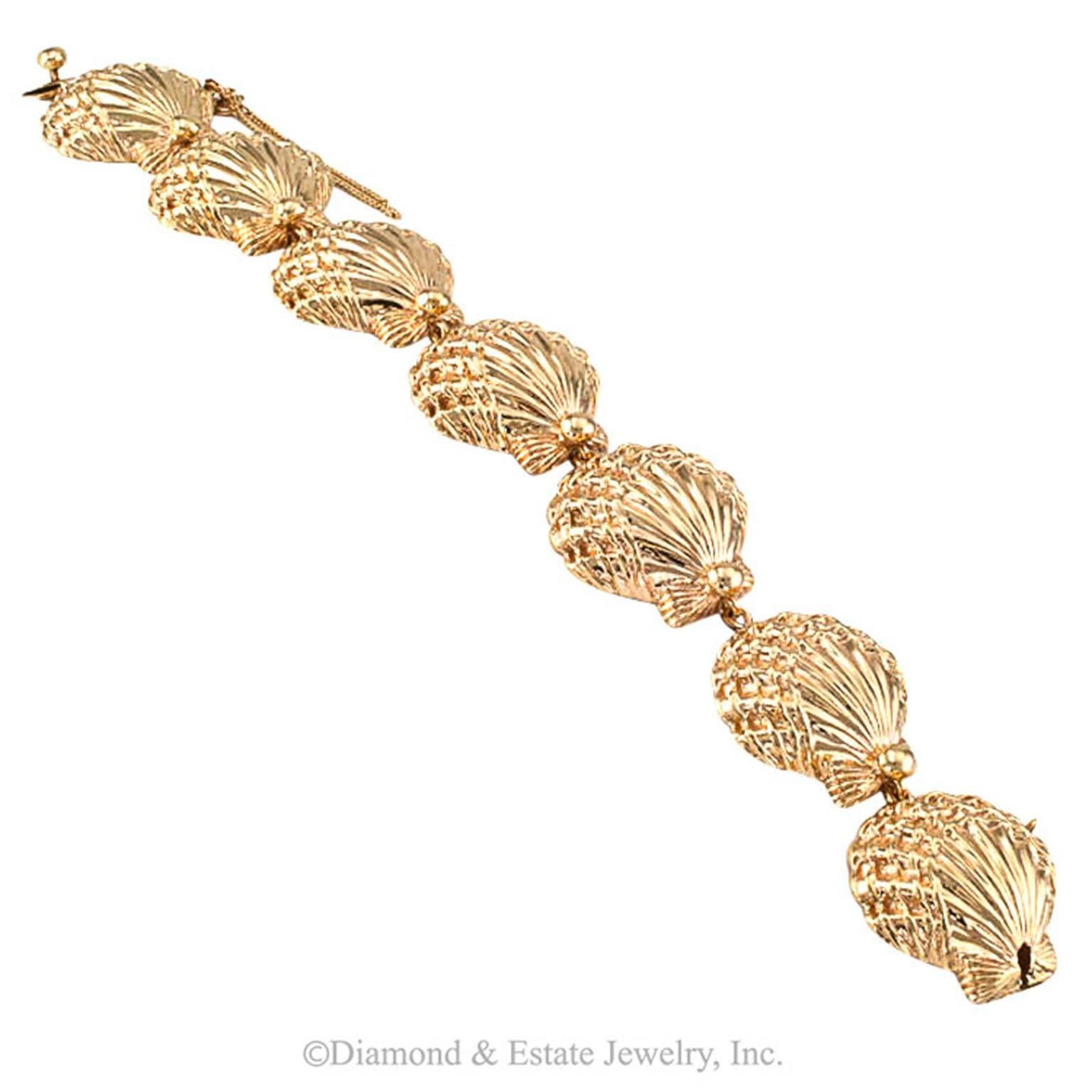 Ruser Estate Gold Sea Shell Bracelet

Picture this:  you are out on a date with your significant other.  It has been a wonderful day.  You find yourselves walking on the beach, occasionally picking up shells that wash up with the surf... the sun
