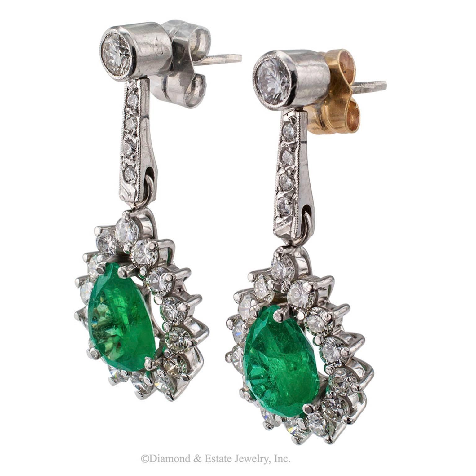 Pear shaped Emerald Diamond White Gold Drop Earrings

Emerald and diamond pendent estate earrings mounted in 18-karat white gold.  The swinging designs feature a pair of pear-shaped emeralds weighing approximately 3.30 carats, within a conforming