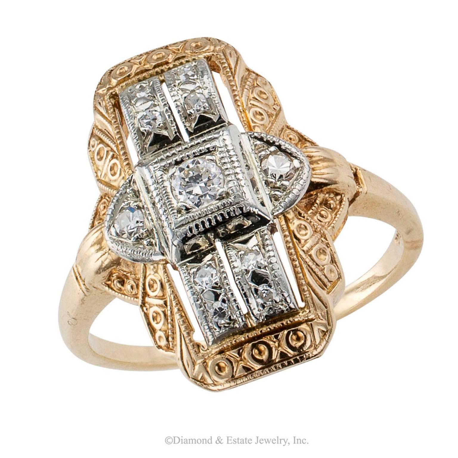 Art Deco 1930s Two-tone Gold Diamond Dinner Ring

Art Deco 1930s two-tone gold and diamond dinner ring with Jabel maker's mark.  Featuring a stepped, central white gold plaque set with diamonds totaling approximately 0.15 carat, within a conforming