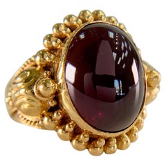 Anillo vintage de los años 90 de Stephen Dweck con turmalina rosa en forma de cabujón, de oro amarillo de 22k