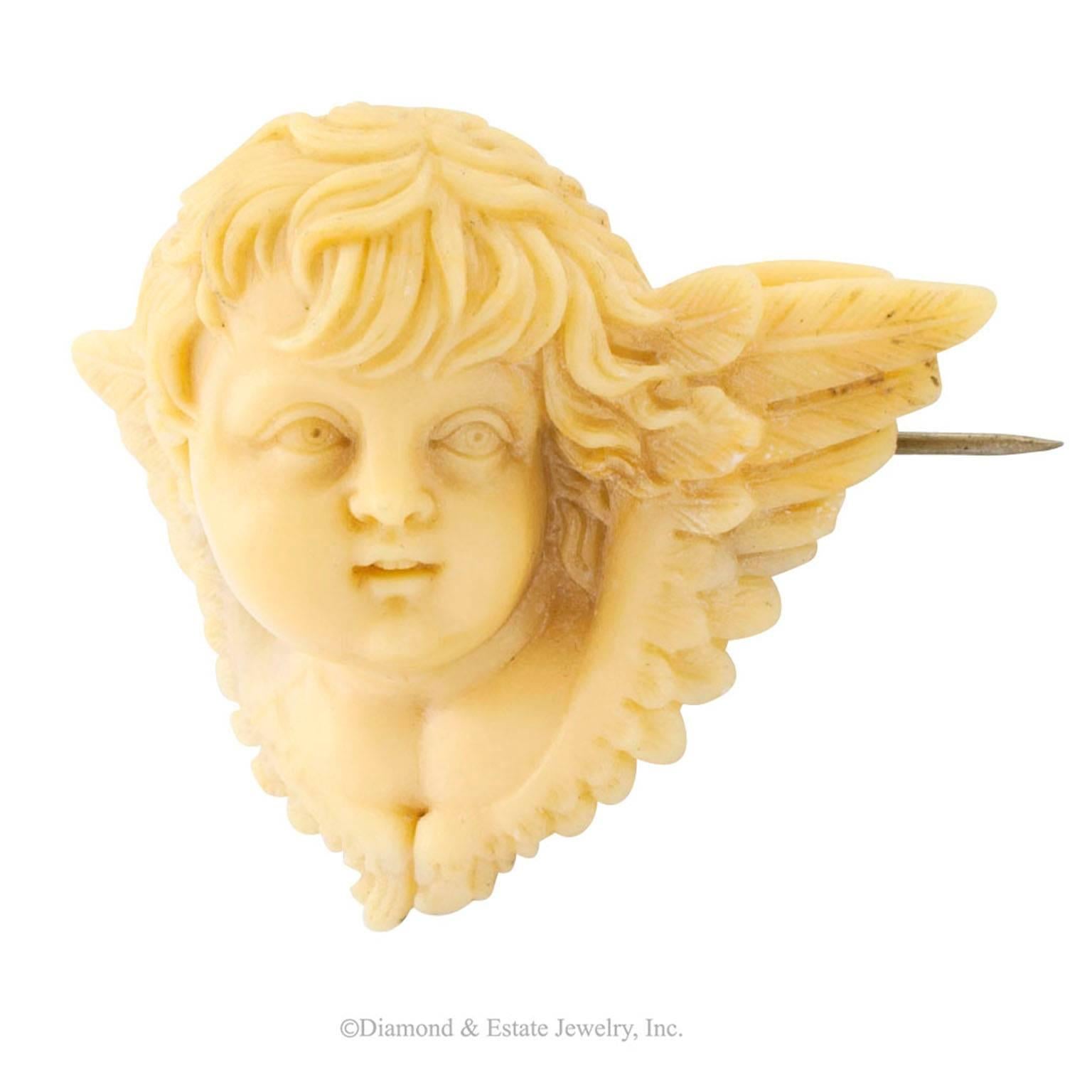 Victorian 1850s Carved Alabaster Cherub Brooch

Victorian 1850s winged cherub alabaster carved brooch.  As far as heraldic celestial beings are concerned, this one is depicted in full three dimensional scale, extracted from creamy alabaster, in the