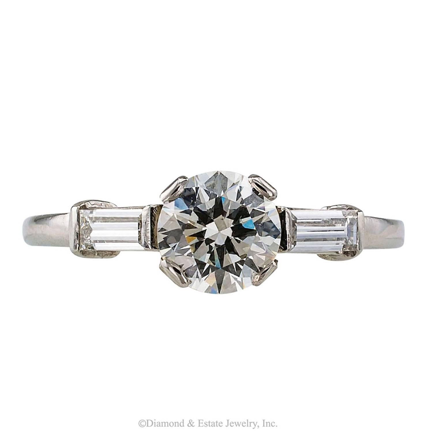 1950s 0.78 Carat Diamond Platinum Engagement Ring

Mid-century 0.78 carat diamond and platinum engagement ring circa 1950.  Perhaps this is the most classic and enduring engagement ring design to come to us in the 21st century from the 1950's, the