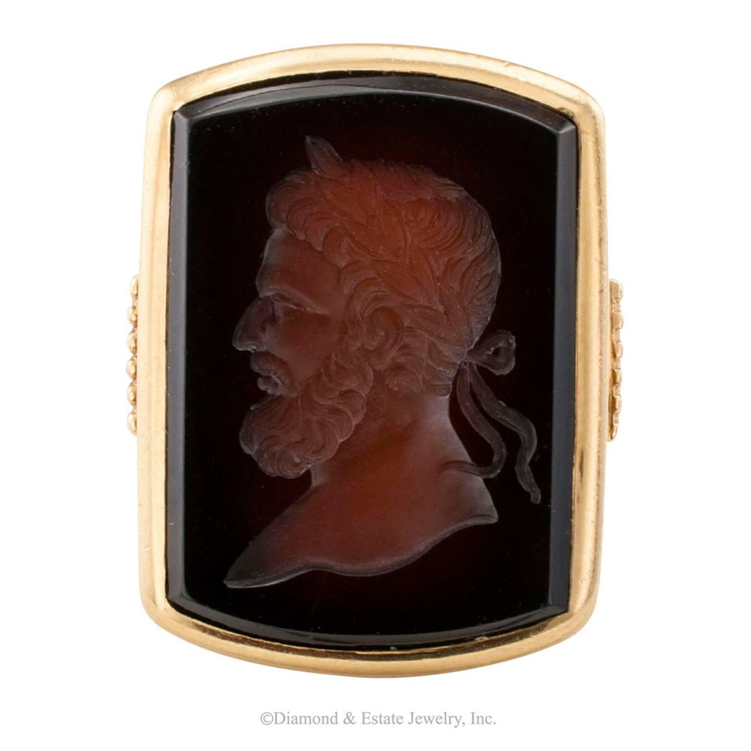 Art Deco 1920s Sardonyx Intaglio Gentlemans Gold Ring

Art Deco 1920s sardonyx intaglio and gold ring.  The Greco-Roman inspired design features a large rectangular sardonyx plaque enlivened by a very  crisp and handsome carving depicting a