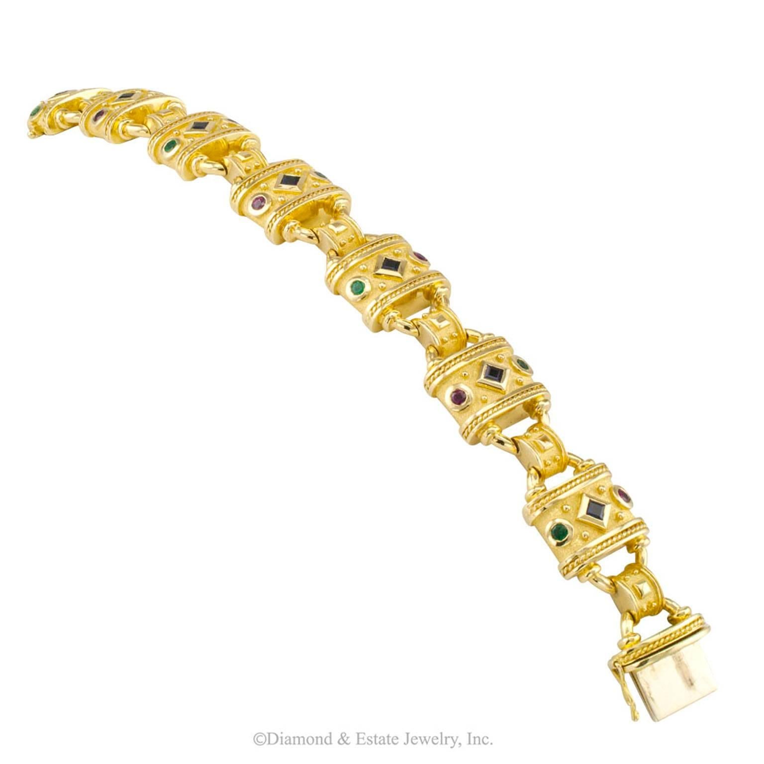 Millennial Greek Gold Bracelet Emerald Ruby Sapphire

Millennial Greek gold link bracelet set with emeralds rubies and sapphires circa 2000.  Attractive and chunky, the padlock like links and connectors integrate sturdy fabrication and attention to