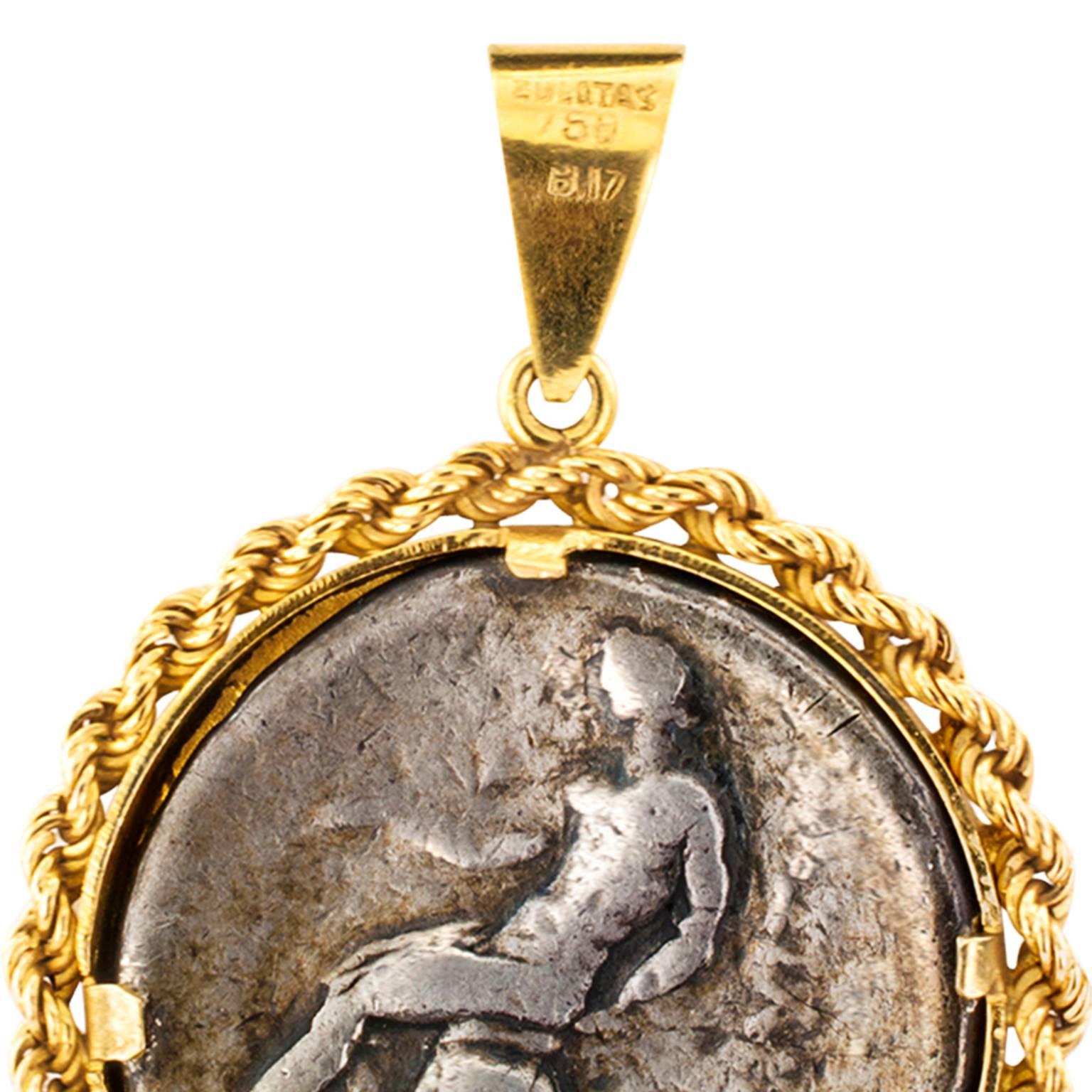 Zolotas Estate Ancient Coin Pendant

Less is more.  Yes.  Here is a prime example of that old saying.  A  very attractive design showcasing an ancient four Drachma Alexander the Great silver coin set within a simple 18 karat yellow gold rope
