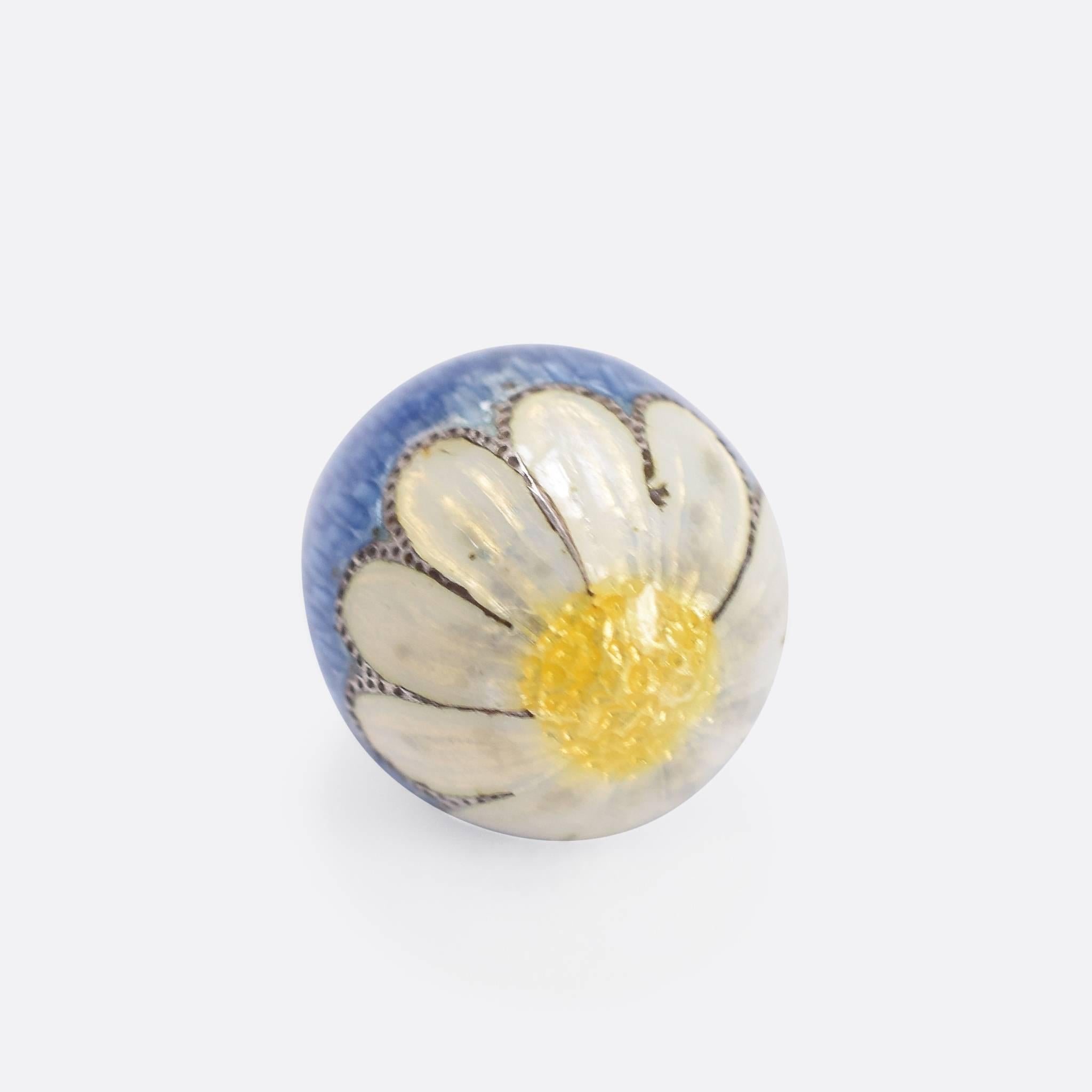 This stunning antique Russian miniature egg pendant is finished in beautiful powder-blue enamel, with a white and yellow daisy spread over the bottom. A fine example of the immensely collectable style, and wonderful with the daisy detail.