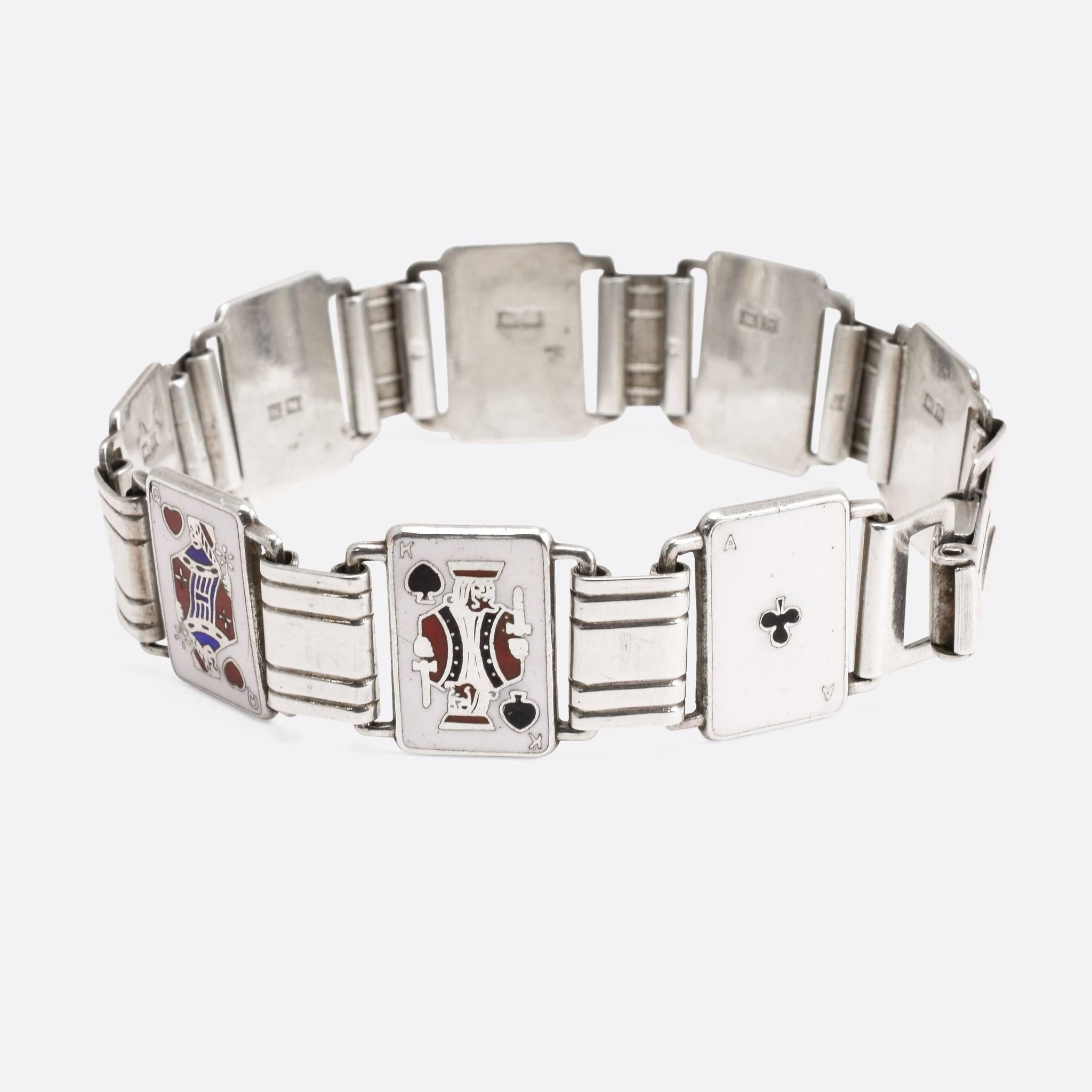 This cool bracelet features eight enamelled playing cards, all Face Cards with the exception of two Aces. Modelled in sterling silver, the bracelet features clear English hallmarks for the year 1957. An exceptionally high quality piece, and lovely