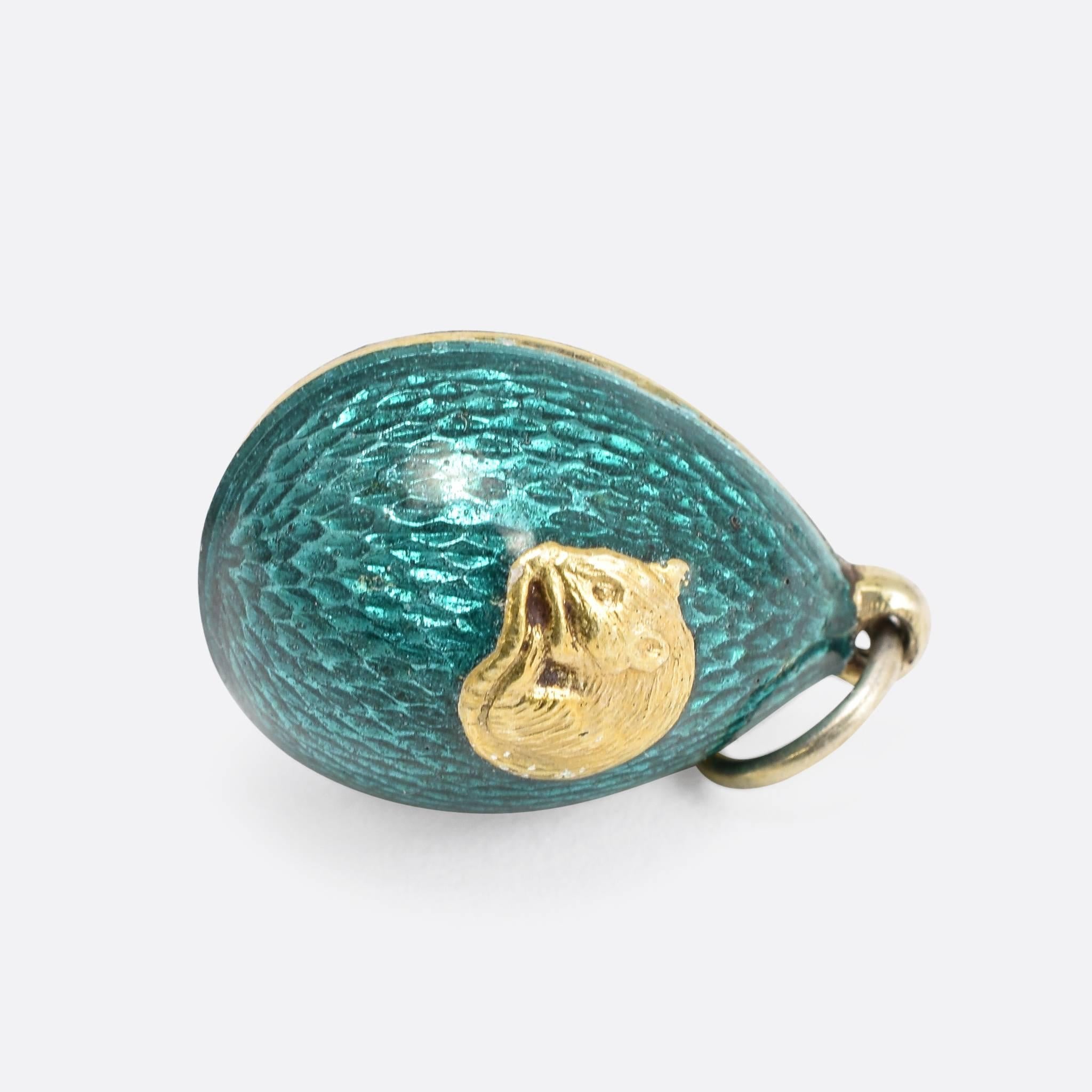 This cute antique miniature egg pendant dates to the early 20th Century. It's finished in gorgeous dark turquoise enamel, and features at the front a sleeping rat. The piece is modelled in 88 zolotnik silver, a higher purity than the usual 84z - the