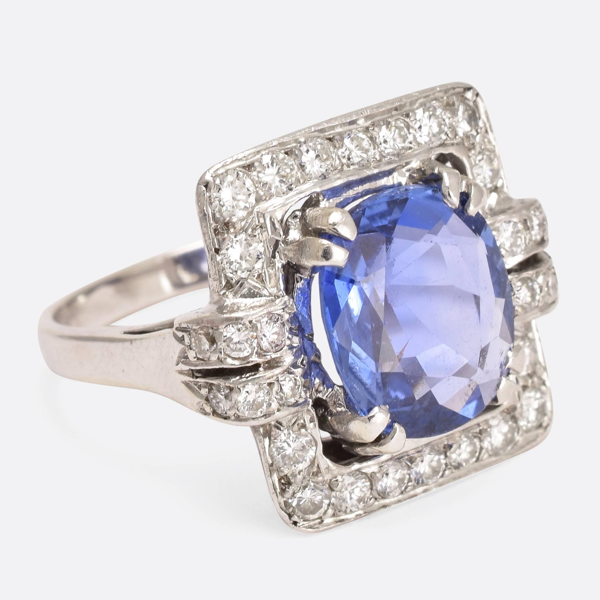 This stunning cornflower sapphire and diamond ring was made in France in the 1920s. The magnificent Art Deco setting is an excellent pair for the main stone, which displays a vibrant colour and strong fire. Modelled in 18ct white gold and platinum,