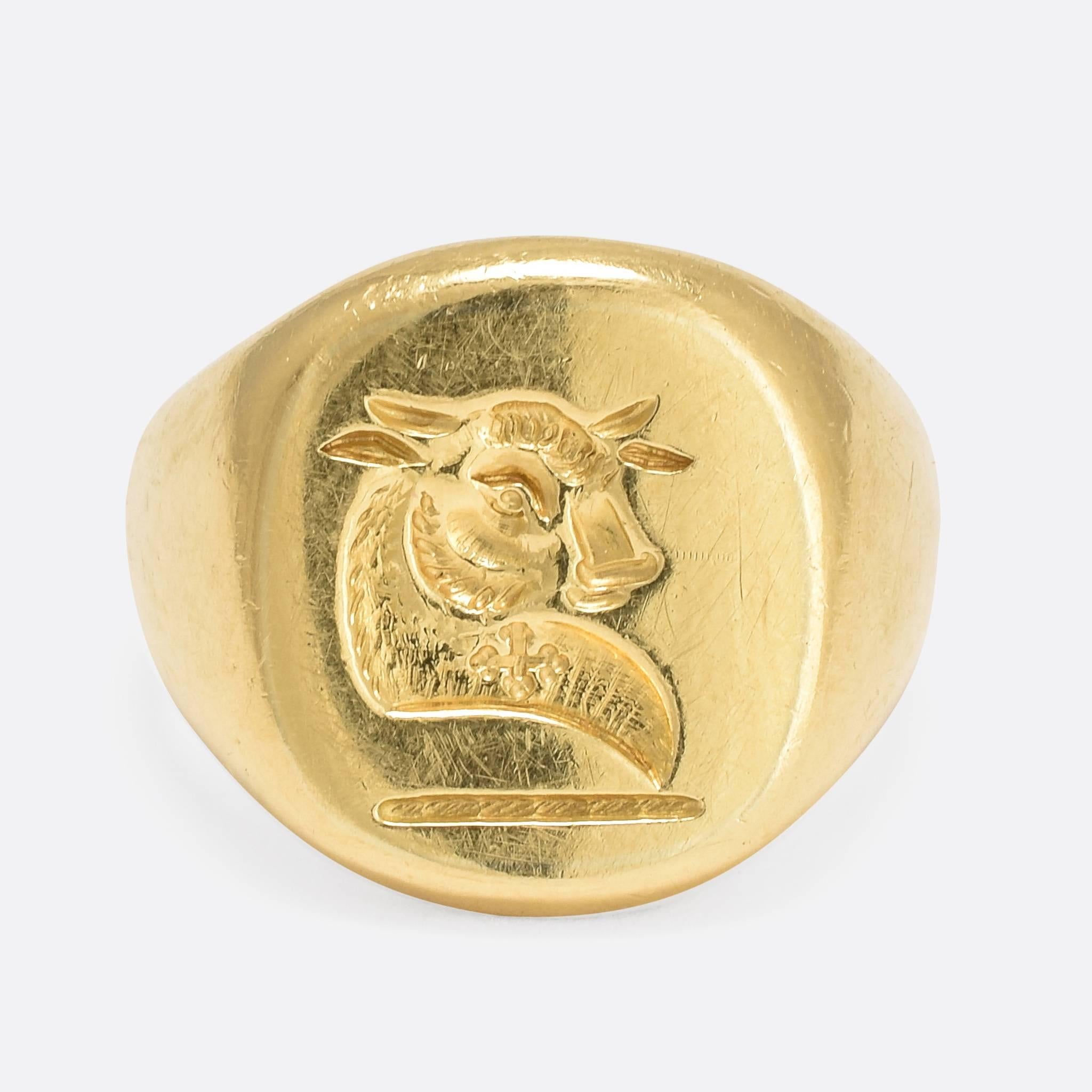 This superb vintage signet ring is carved with a heraldic intaglio crest: depicting a bull with quatrefoil. This incarnation of the bull was adopted by many families, including: Archer, Clud, Hunter, Stark, and Turnbull. It's modelled in 18ct yellow