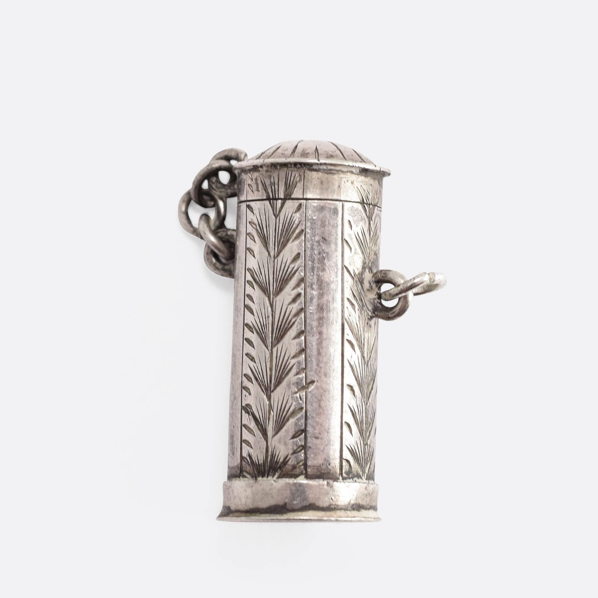 This surprising antique charm pendant is modelled in sterling silver. The spring-loaded horned devil head leaps out of the box, when the catch is released - throwing the lid off the top. The piece is attractively decorated with hand-chased detailing