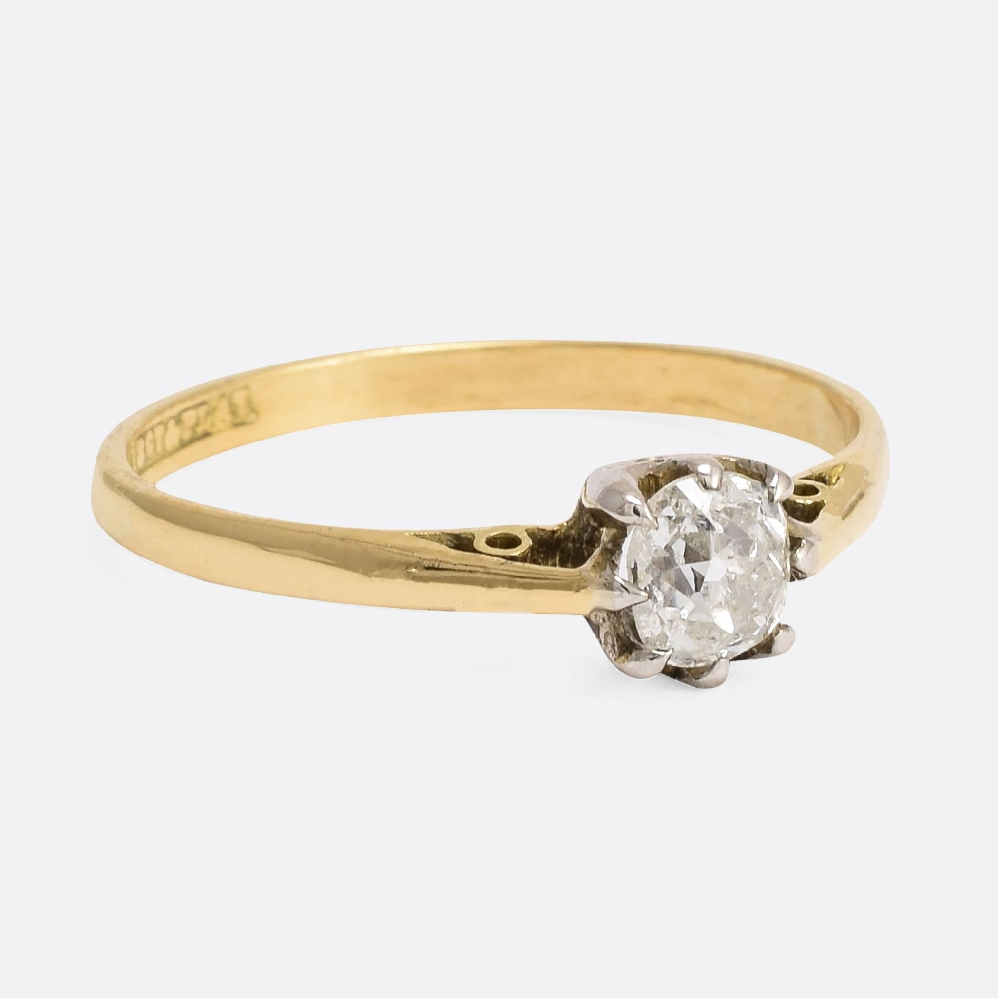 A very sweet antique engagement Ring. The 18ct gold and platinum mount is set with a lovely half carat cushion cut diamond in 8-claw setting - typical of the period. Ring Size: US: 6.75, or UK: N.