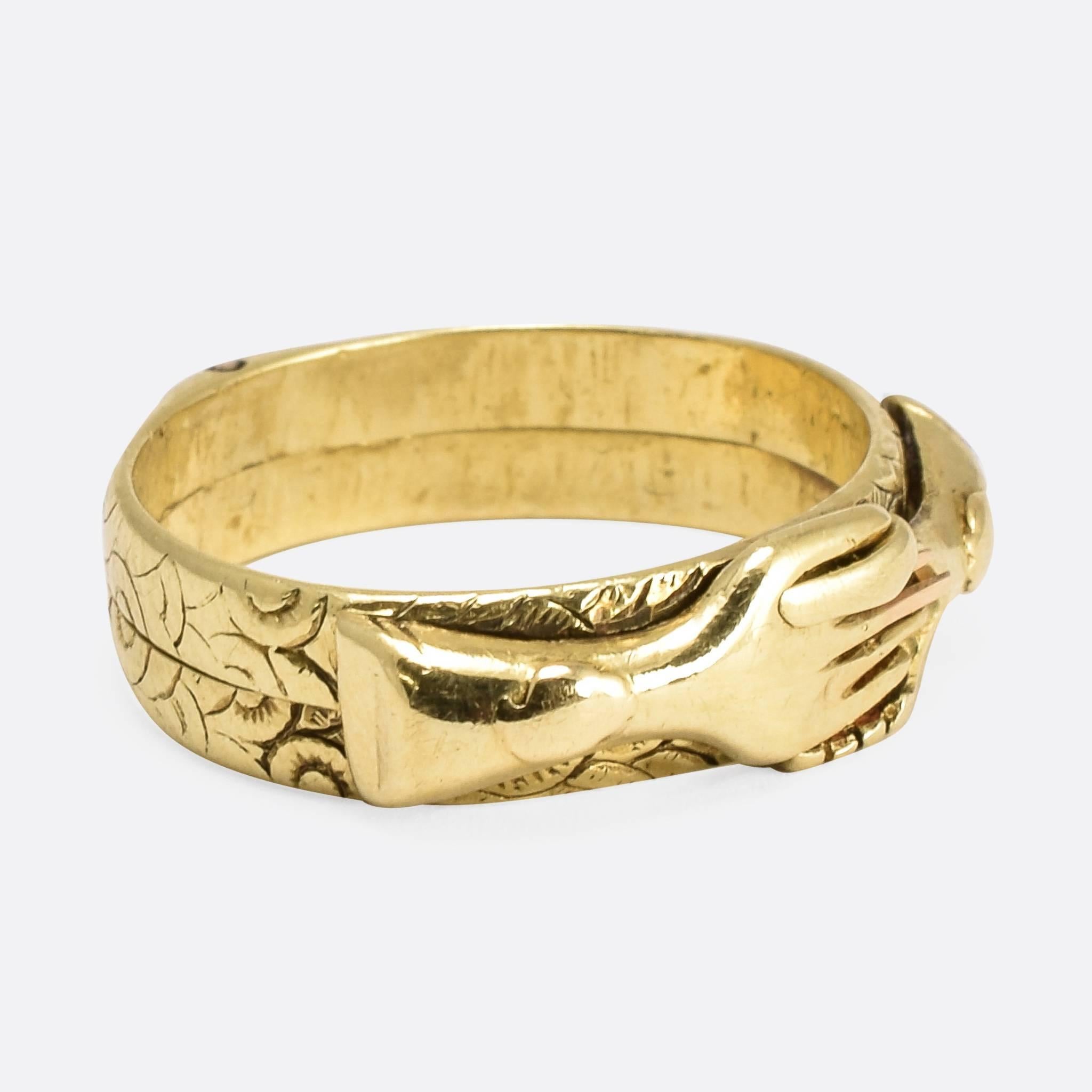 A particularly high quality early  gimmel fede handclasp ring, with two linked bands that open, allowing the hands to slide apart and back together again. The bands feature pretty hand-chased detail all around, and the piece is modelled in 15ct gold