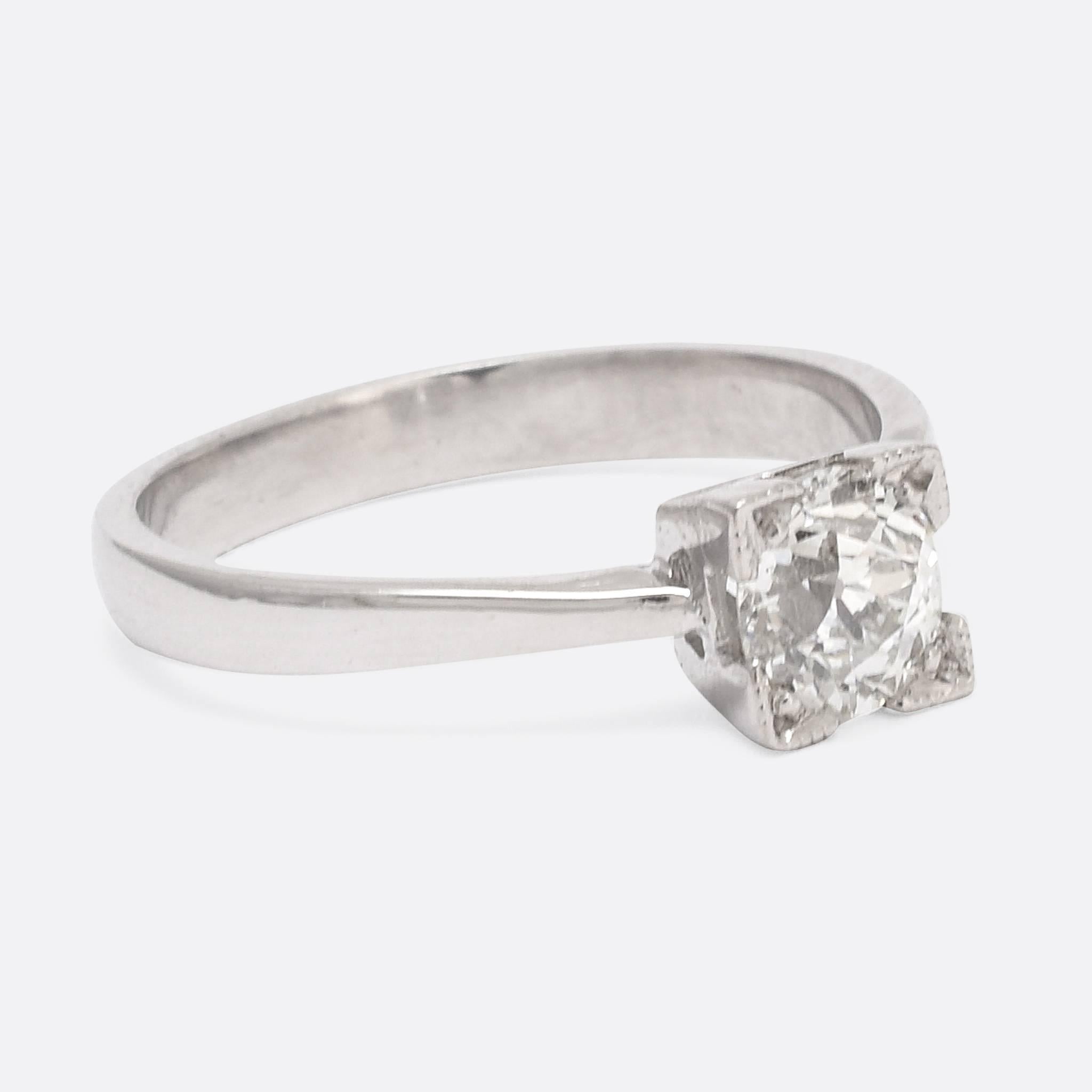 We have set an antique old European cut diamond in a contemporary ring mount of our own design. The beautiful .66ct stone is GIA certified - VS1 Clarity and J Colour - held in a square four-claw setting with millegrain detail, that takes inspiration