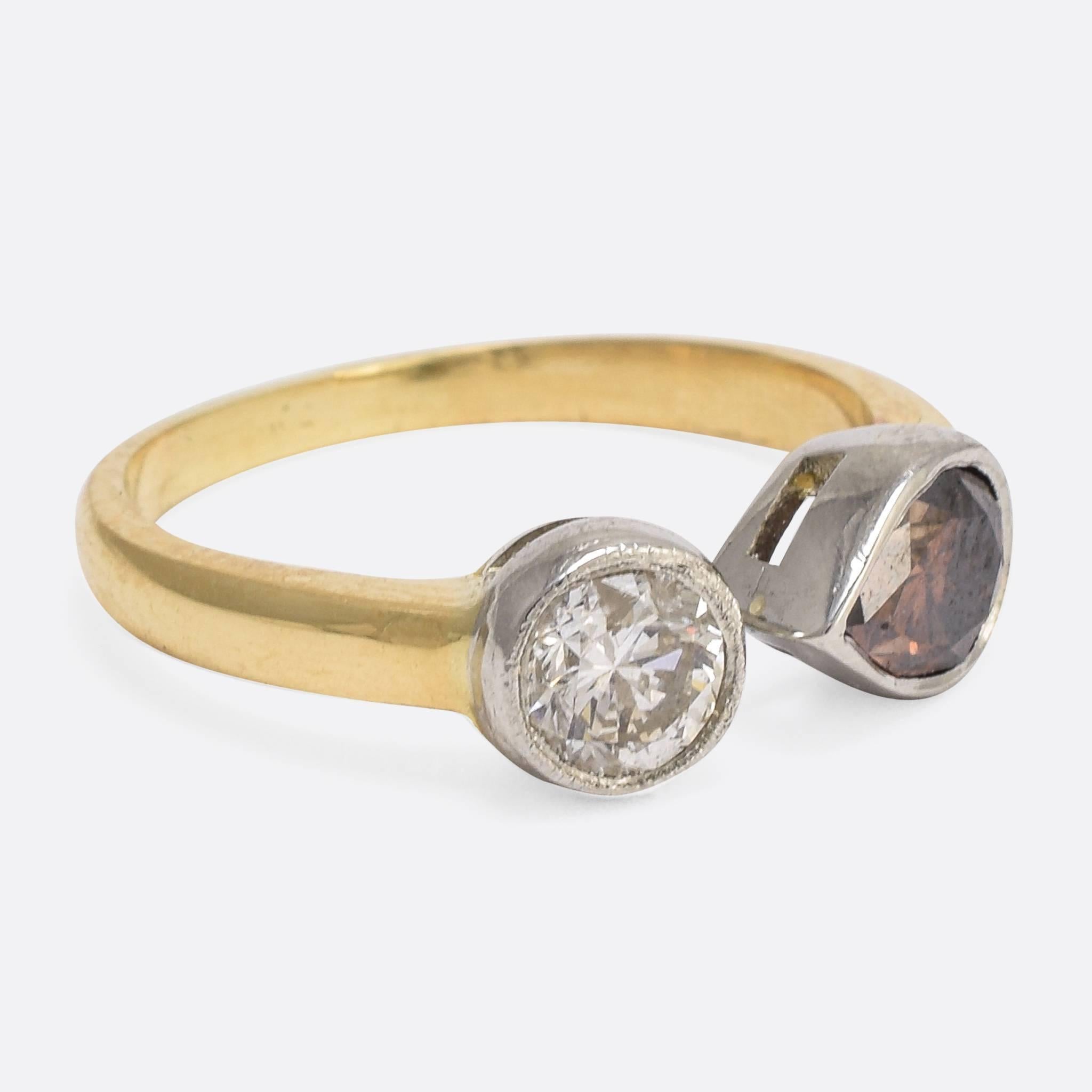 We have set these outstanding diamonds in a contemporary "Toi et Moi" ring mount of our own design. The pear cut stone weighs 1.2ct with a lovely cognac brown colour; while the .54ct brilliant cut diamond shows excellent clarity and
