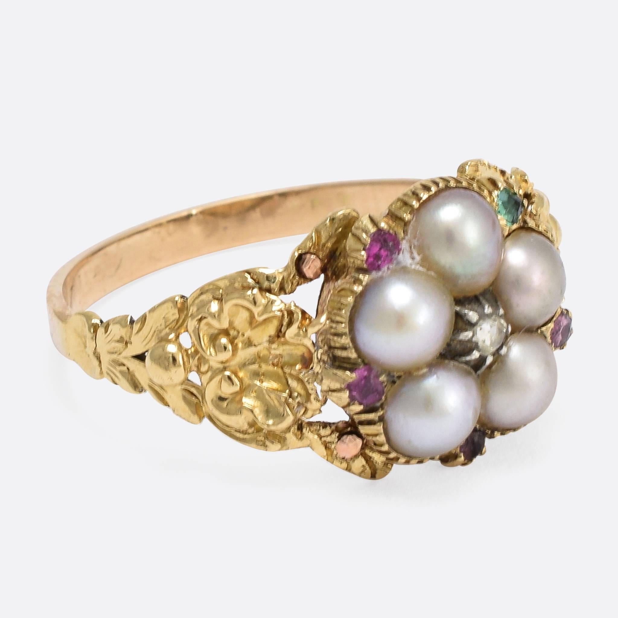 This impressive antique acrostic ring is set with natural pearls, and first letter of each coloured gemstone spells out the romantic sentiment "regard": ruby emerald garnet amethyst ruby diamond. The shoulders display beautiful shell and