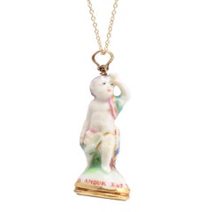 Antique 18th Century Derby Chelsea “Cupid on Tree-stump with Mug” Porcelain Fob Pendant