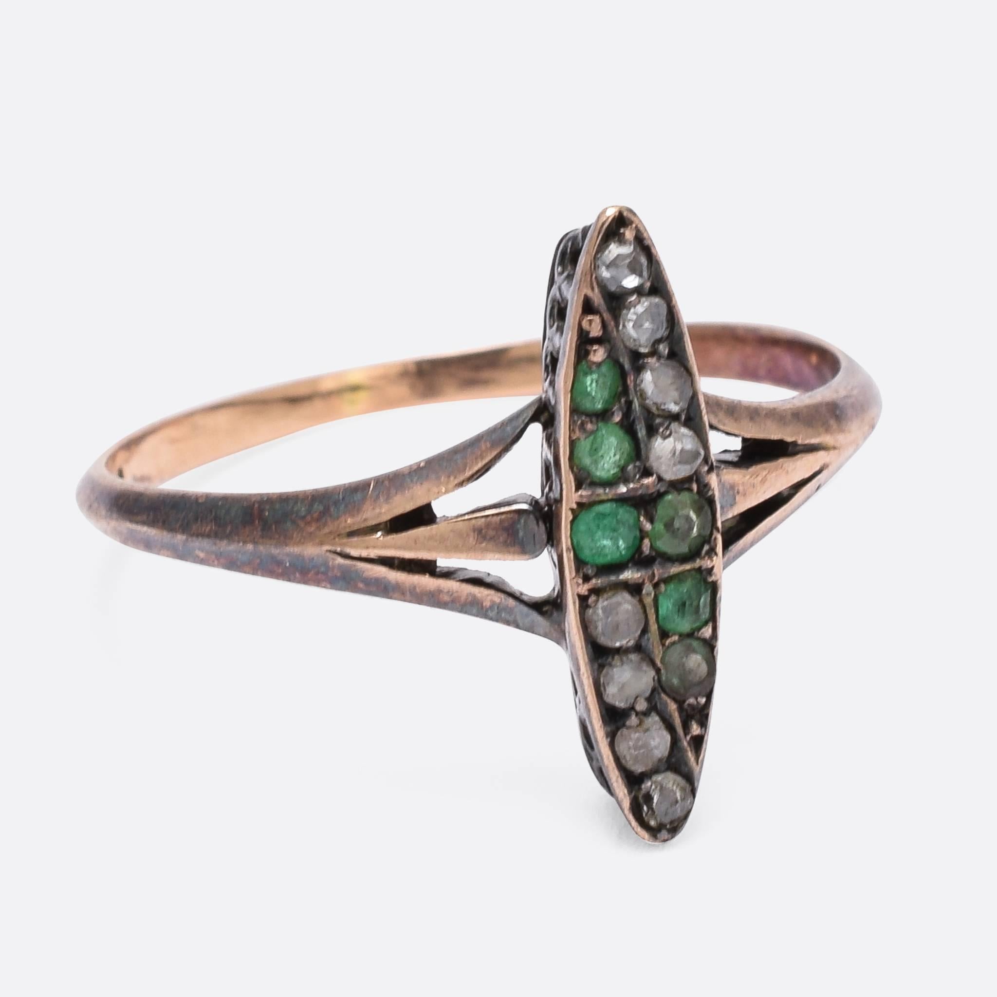 This dainty Art Nouveau ring was made in the late 19th Century, c.1890. The exaggerated marquise shaped head is set with rose cut diamonds and emeralds. It's modelled in 14ct rose gold, with pretty trifurcated shoulders and a gorgeous antique