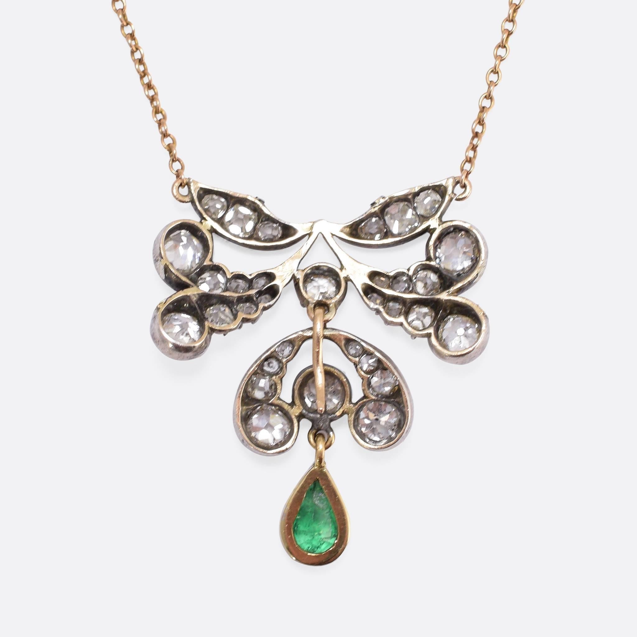 A superb early Victorian necklace, set with around 1.70 carats of old cut diamonds, and a beautiful natural emerald drop. Modelled in 15ct gold and silver, the piece hangs on a 16.5 inch chain and sits beautifully just below the neck. 
