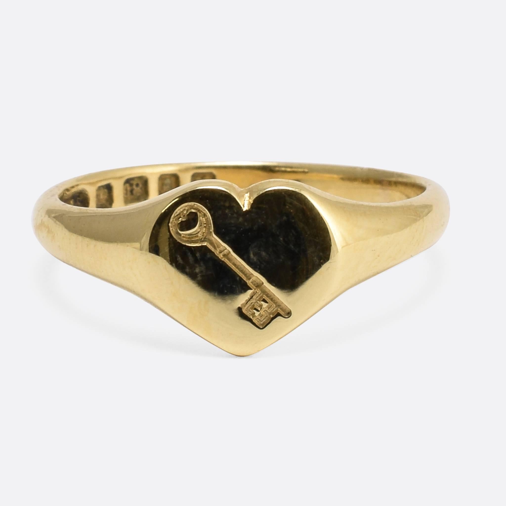 A Key Ring. This Art Deco era Signet Ring features a heart-shaped face engraved with a key intaglio... A key to my heart... The key itself has a heart shape in its head... A heart within a heart... So much sentiment going on here. It bears clear