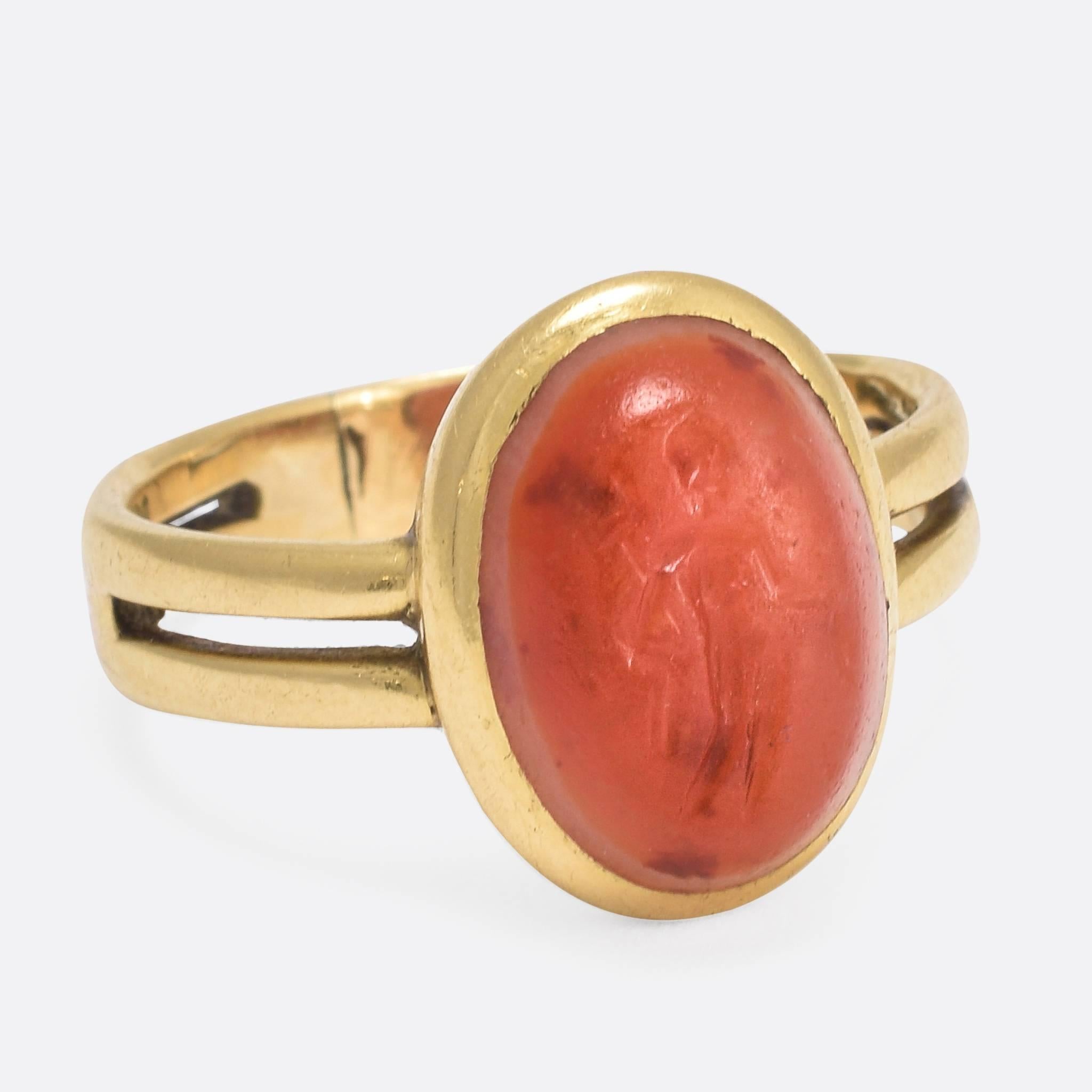 This splendid Georgian era ring has been set with an ancient Roman intaglio, depicting the goddess Fortuna. This deity, known as Tyche in Greek mythology, was the personification of luck - both good and bad - in Roman religion. The daughter of