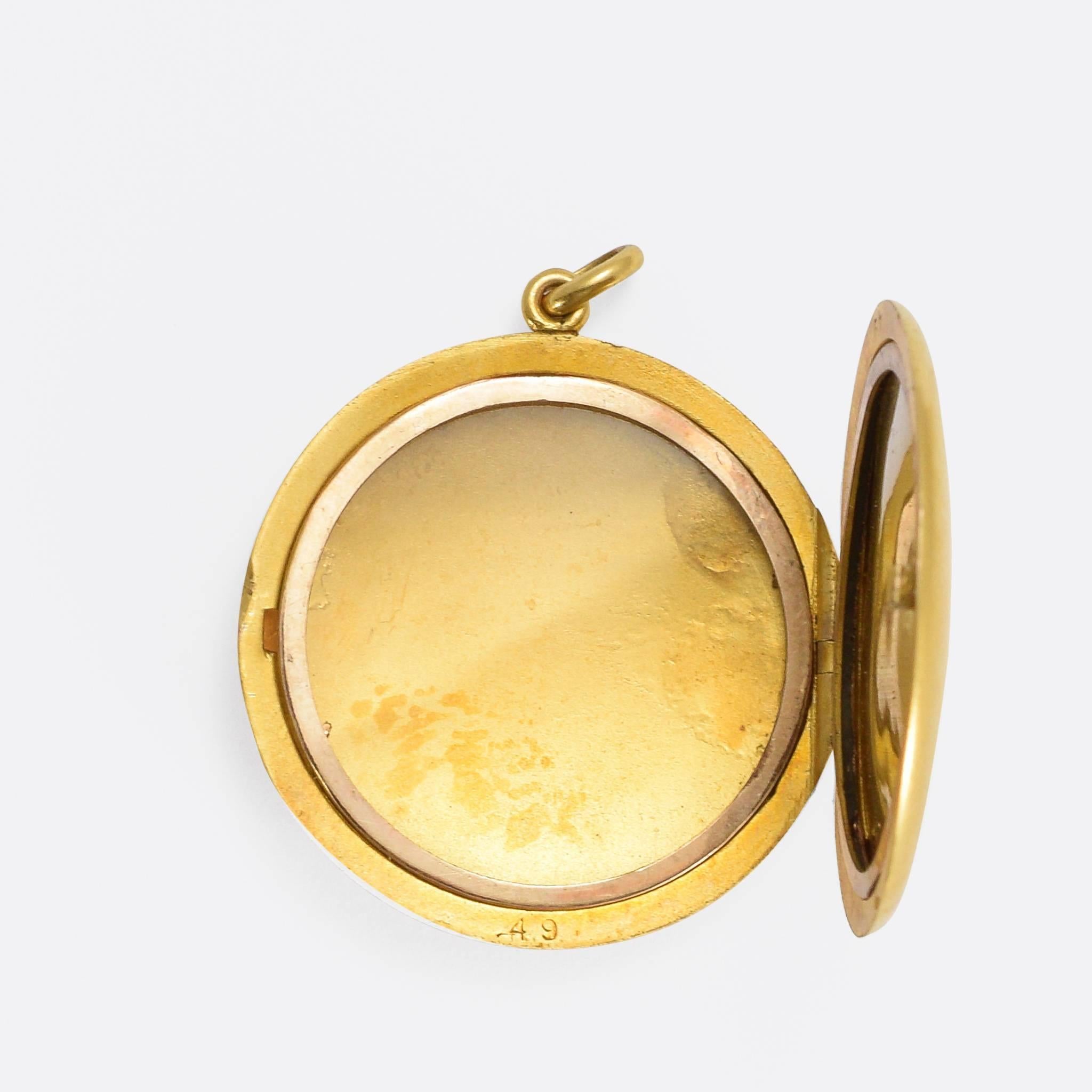 This beautiful round locket is set with a single old English brilliant cut diamond, inside a pretty star motif. It's modelled in rich 15k gold, lightly brushed to give a gorgeous matte effect, and dates to c.1880.